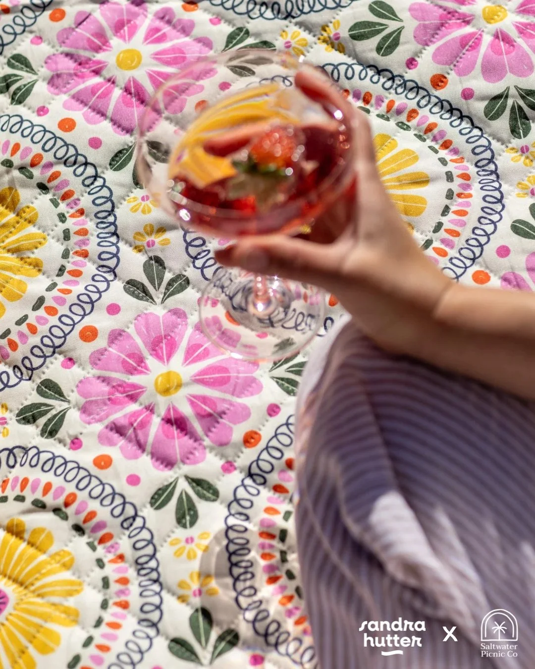 Sunshine, florals, and a good drink in hand &mdash; what more do you need? 🍹⁠
This picnic blanket is part of my Heirloom Garden collection and available now through @saltwaterpicnicco ✨⁠
⁠
It&rsquo;s summer in Australia right now, while it&rsquo;s a