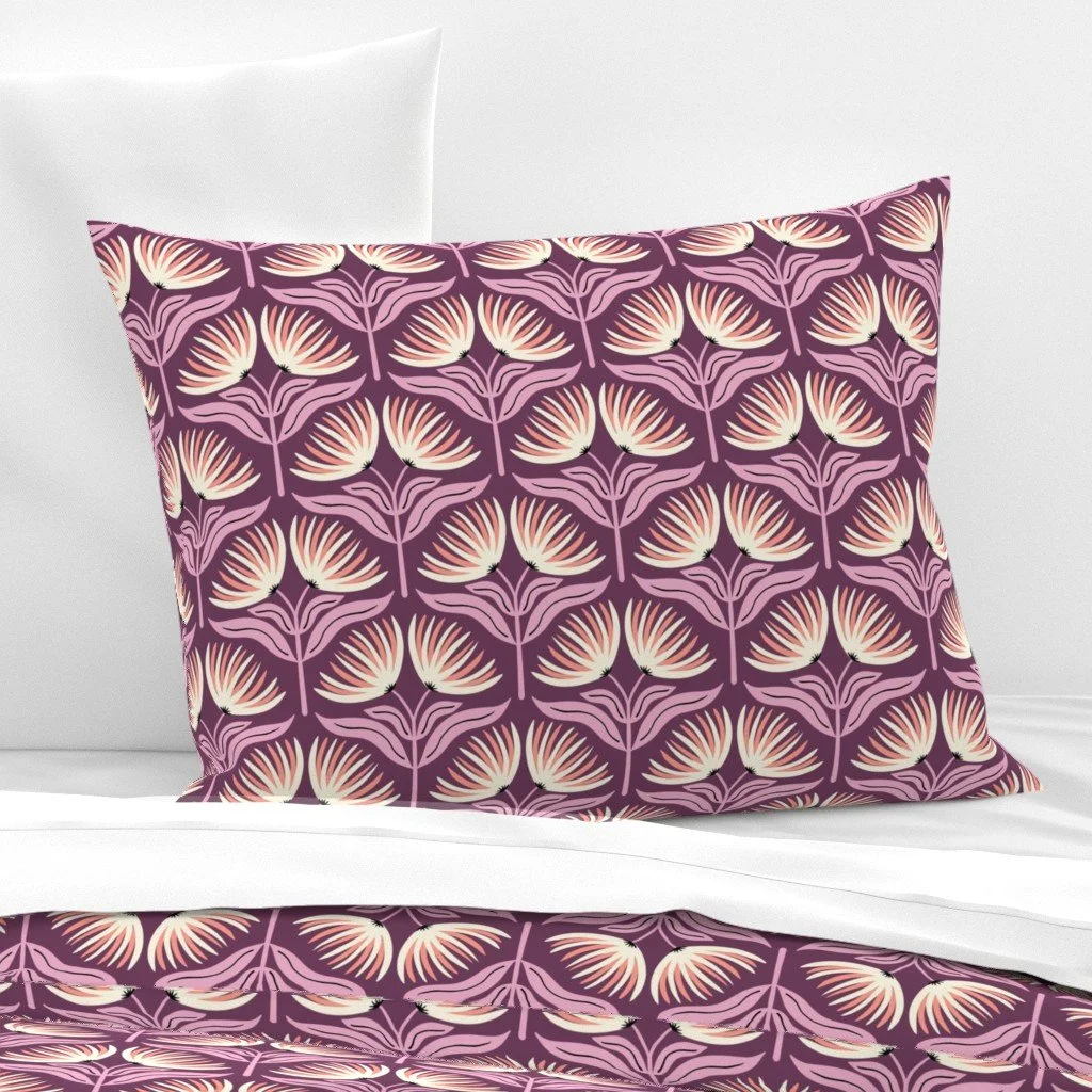 Pillow sham (bedding) with cream and coral fan flowers on a deep plum ground, copyright Sandra Hutter.