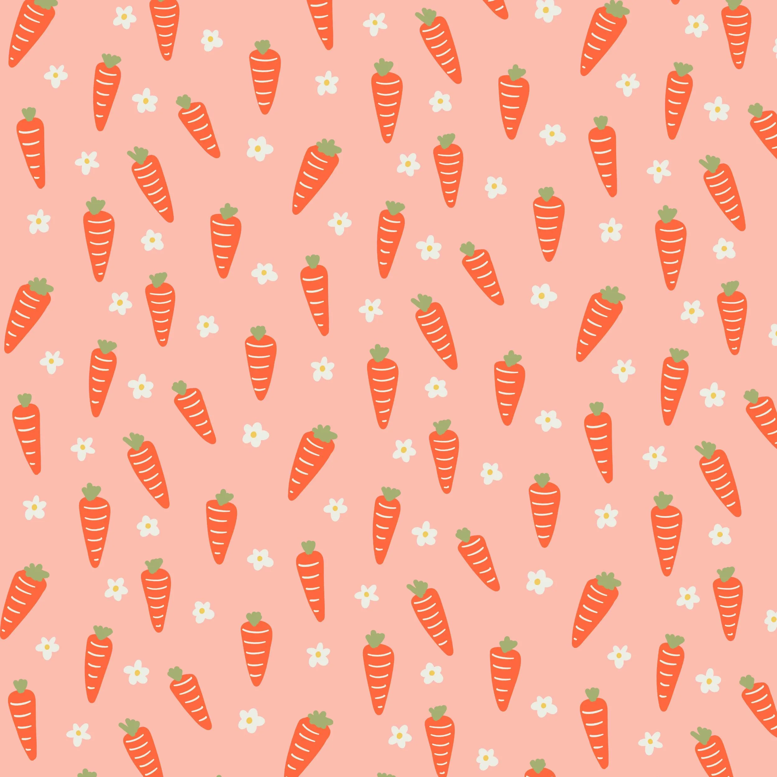 Series of cute, cartoon style orange carrots with little bushy green tops and white five petal flowers scattered intermixed on a pastel peachy-pink background. Great pattern for Easter or cottagecore clothing or home decor