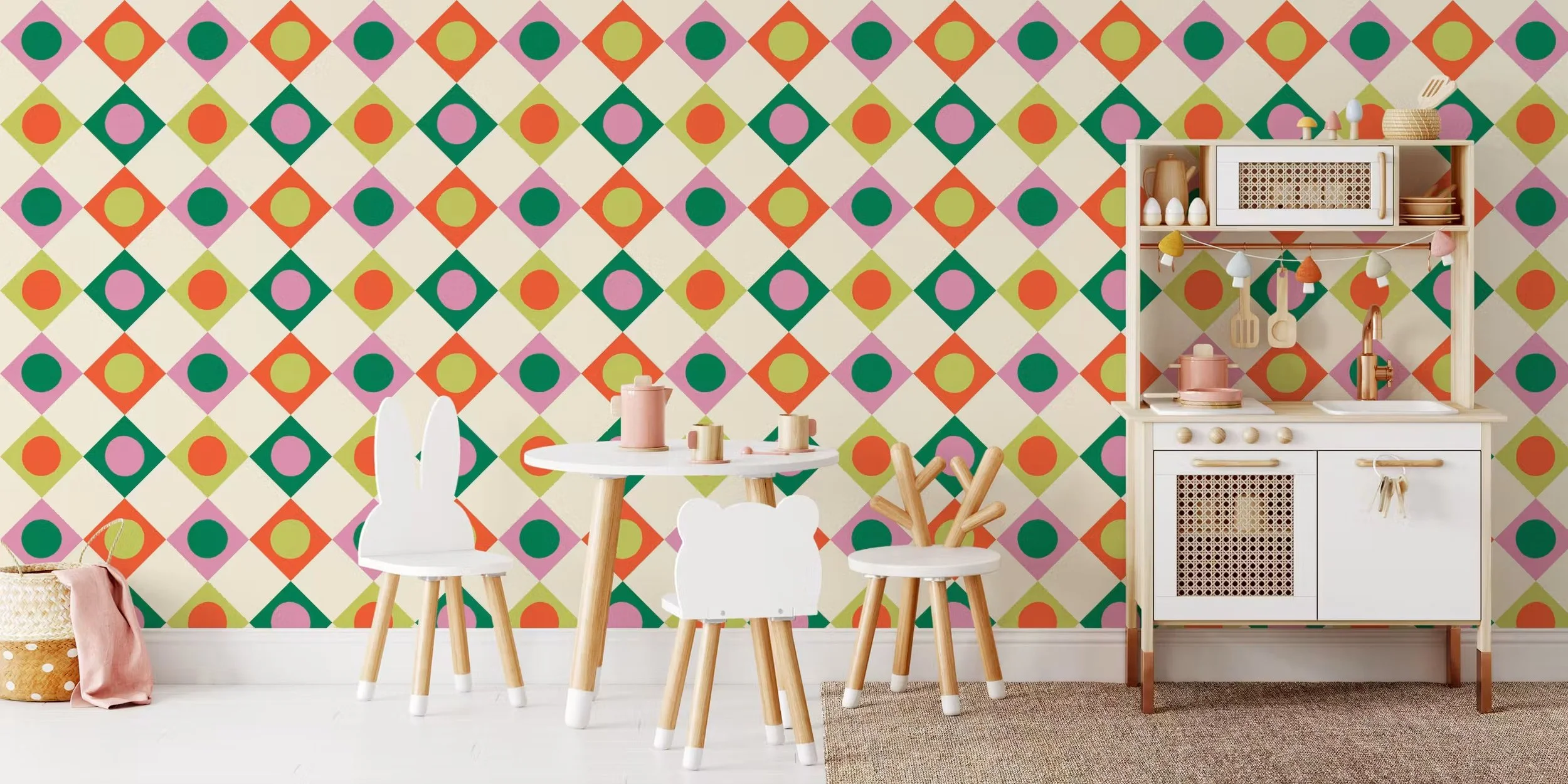 Harlequin diamond wallpaper with gumball dots in pink, tangerine, lime and kelly green in a playroom with a play kitchen, copyright Sandra Hutter.