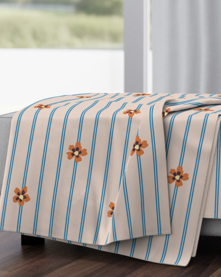 blush-and-blue-ticking-stripe-with-folk-flower-medium-throw-blanket-mockup.png