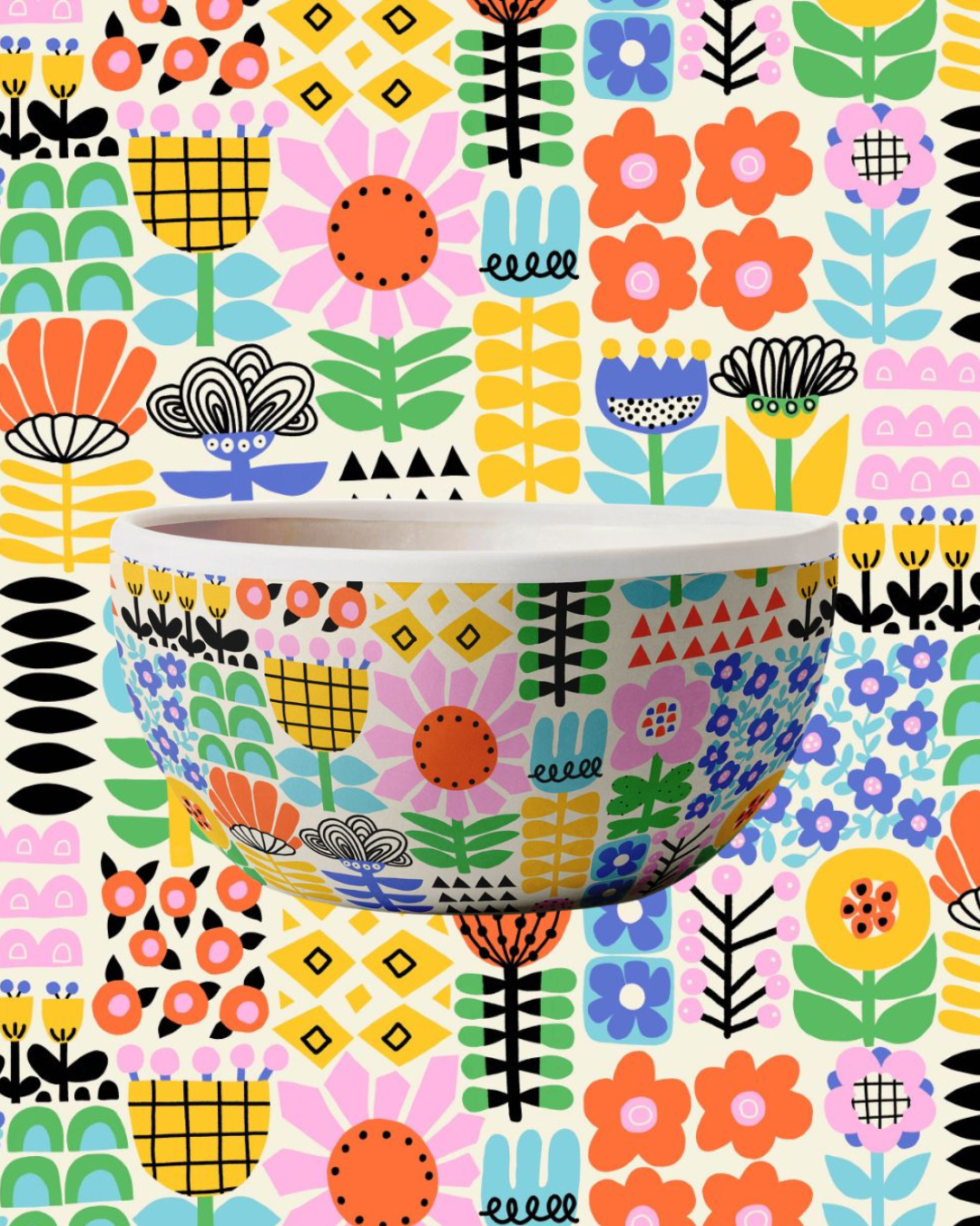 Colorful hand-painted surface pattern artwork shown on wallpaper and a decorative bowl, demonstrating art licensing for home décor, kitchenware, ceramics, and lifestyle products. Artwork © Sandra Hutter.
