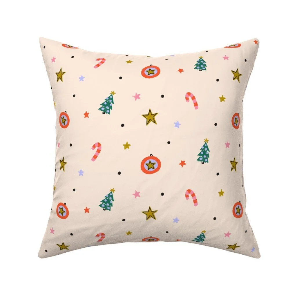 Jolly & Bright: Ditsy Christmas Toss with Candy Canes and Stars on Cream on a throw pillow by Spoonflower, copyright Sandra Hutter.