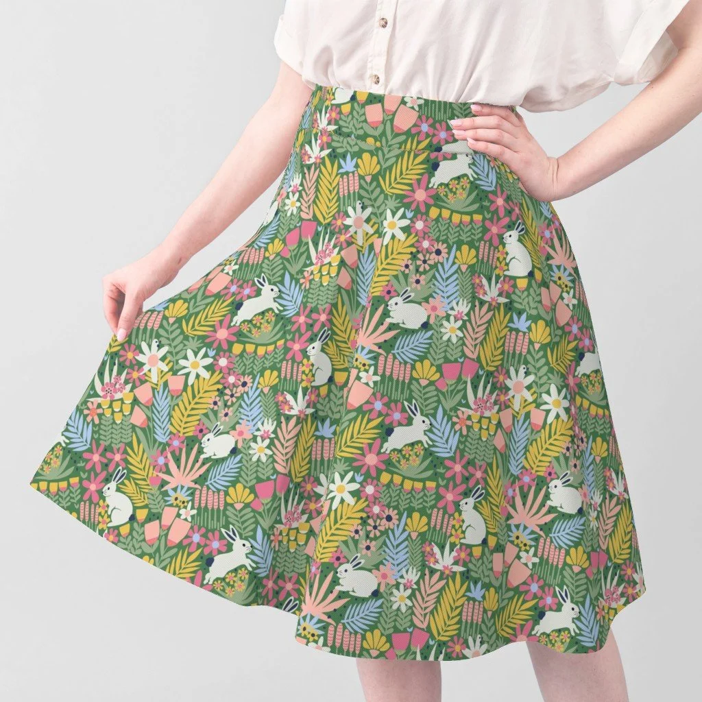 Skirt featuring the pattern Happy White Bunnies in a Colorful Flower Field - Green