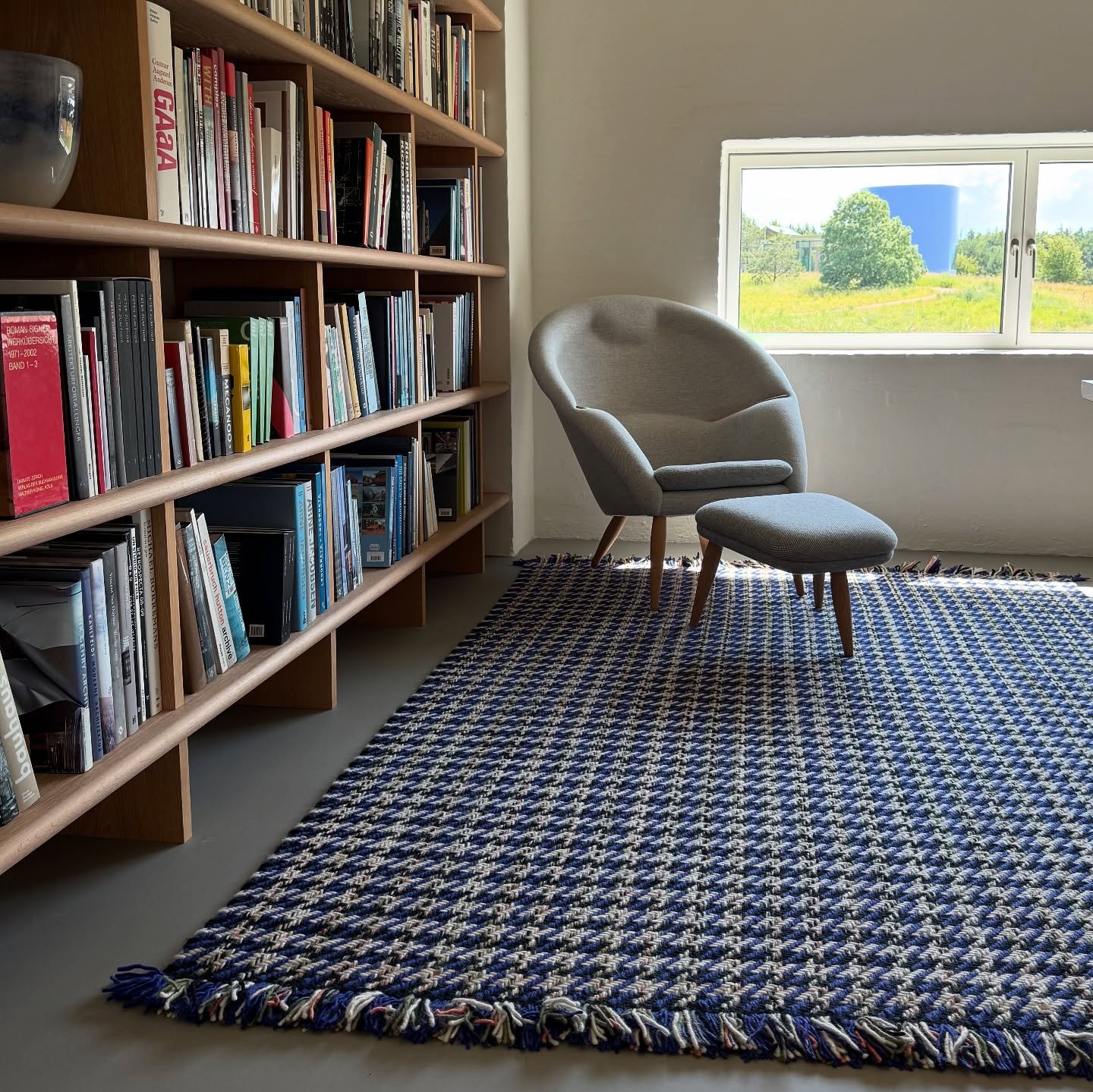 I found my favorite cosy spot at @kvadrattextiles headquarters in Ebeltoft, Denmark. I could spend hours here, supported in the Oda Lounge from @audocph and nestled in the corner with a colorful rug from Kvadrat.