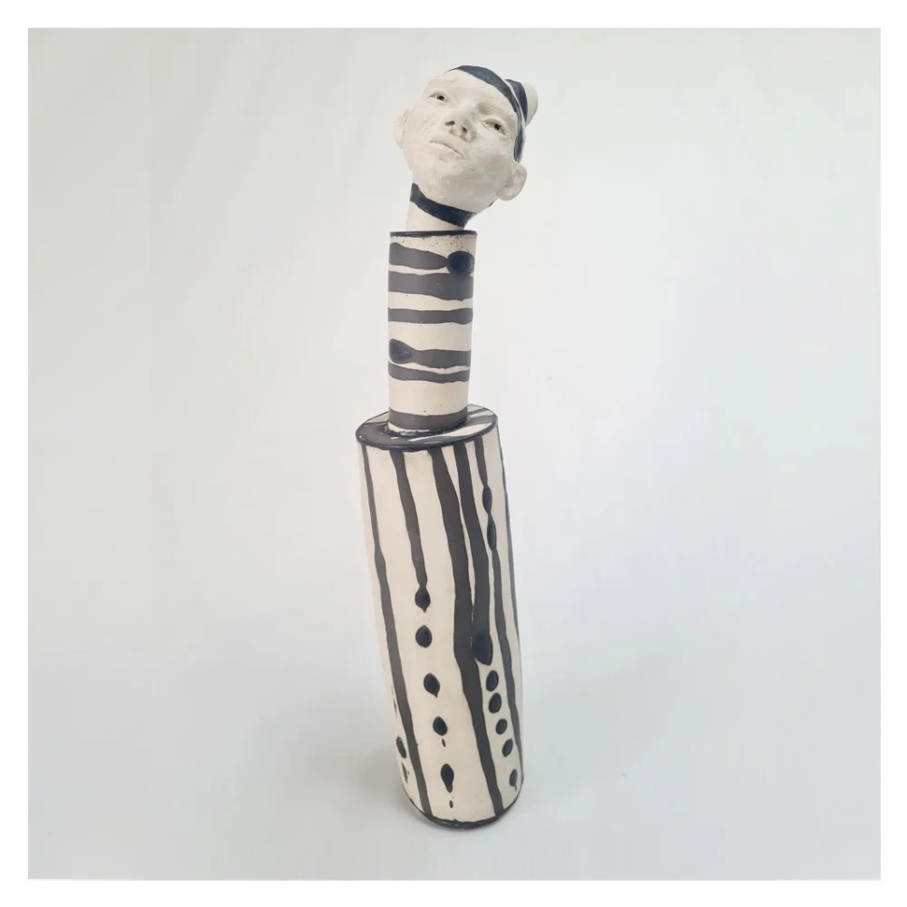 Ceramic bottle head sculpture