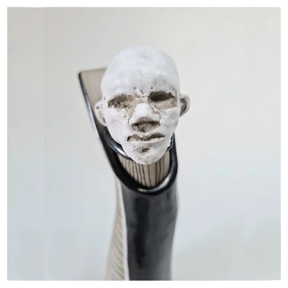 Vase with sculpted head stopper (close up)