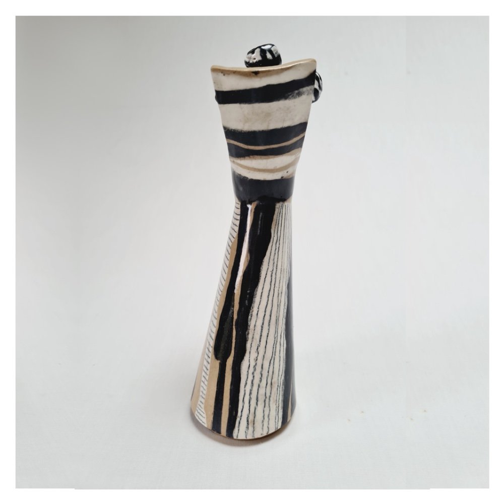 Ceramic sculpture with removable head (back).jpg