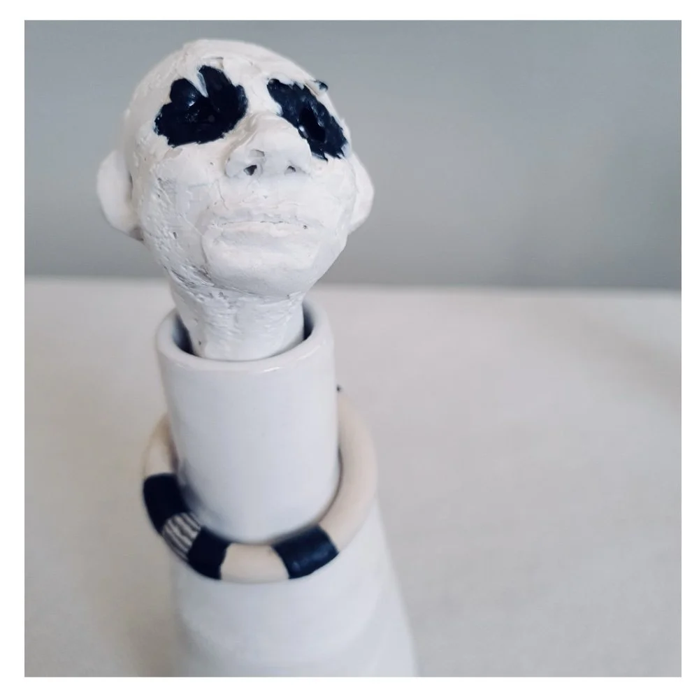 Figurative ceramic bottle close up