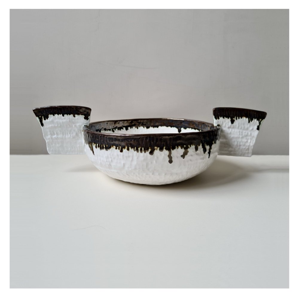 Winged metallic black and white ceramic bowl by Harriet Ferris