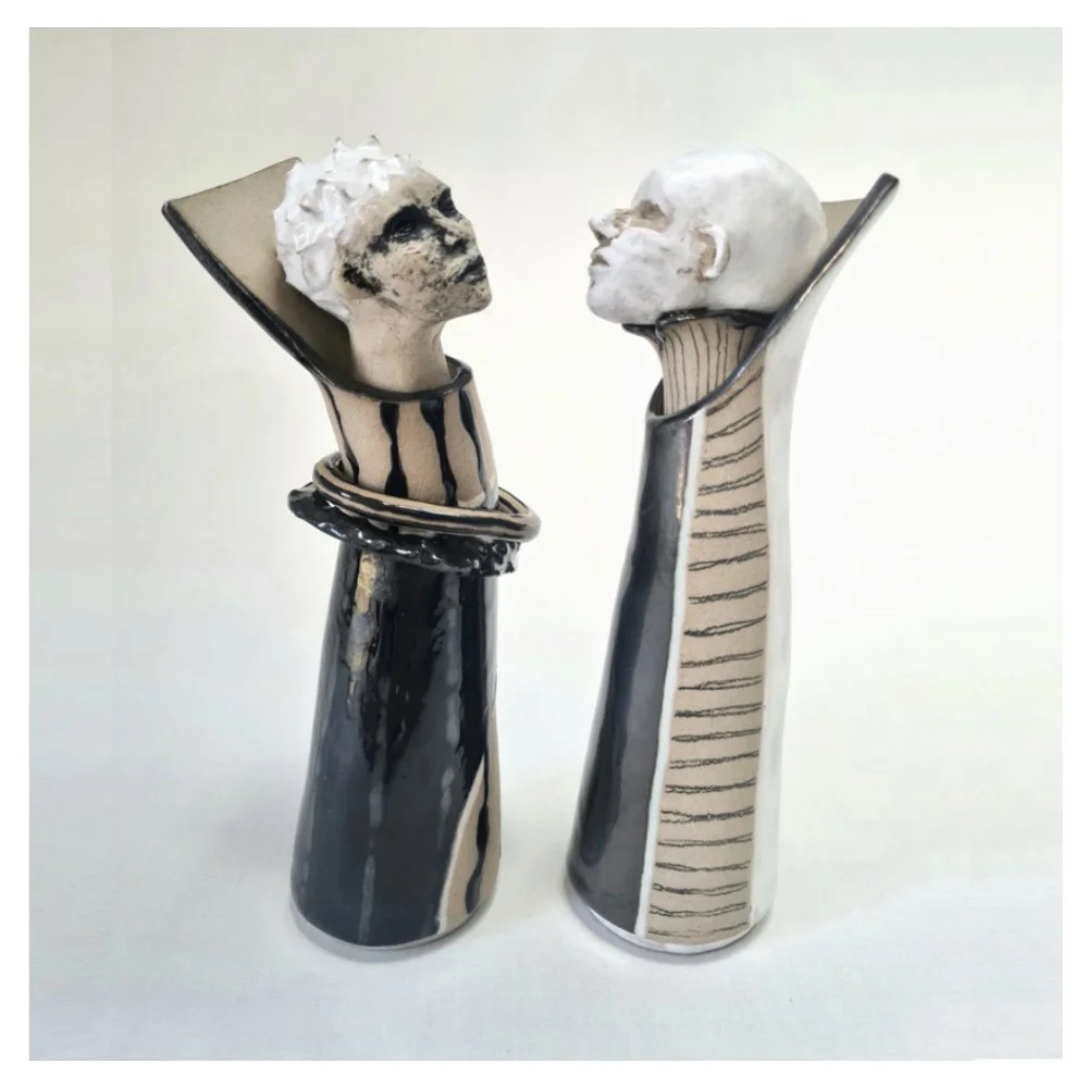 Vases with sculpted head stoppers