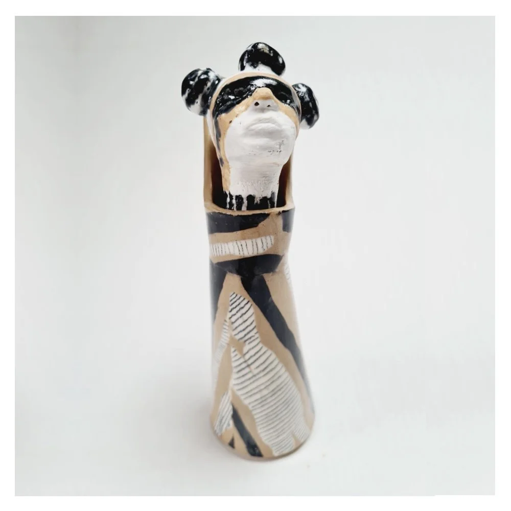 Ceramic sculpture with removable head .jpg