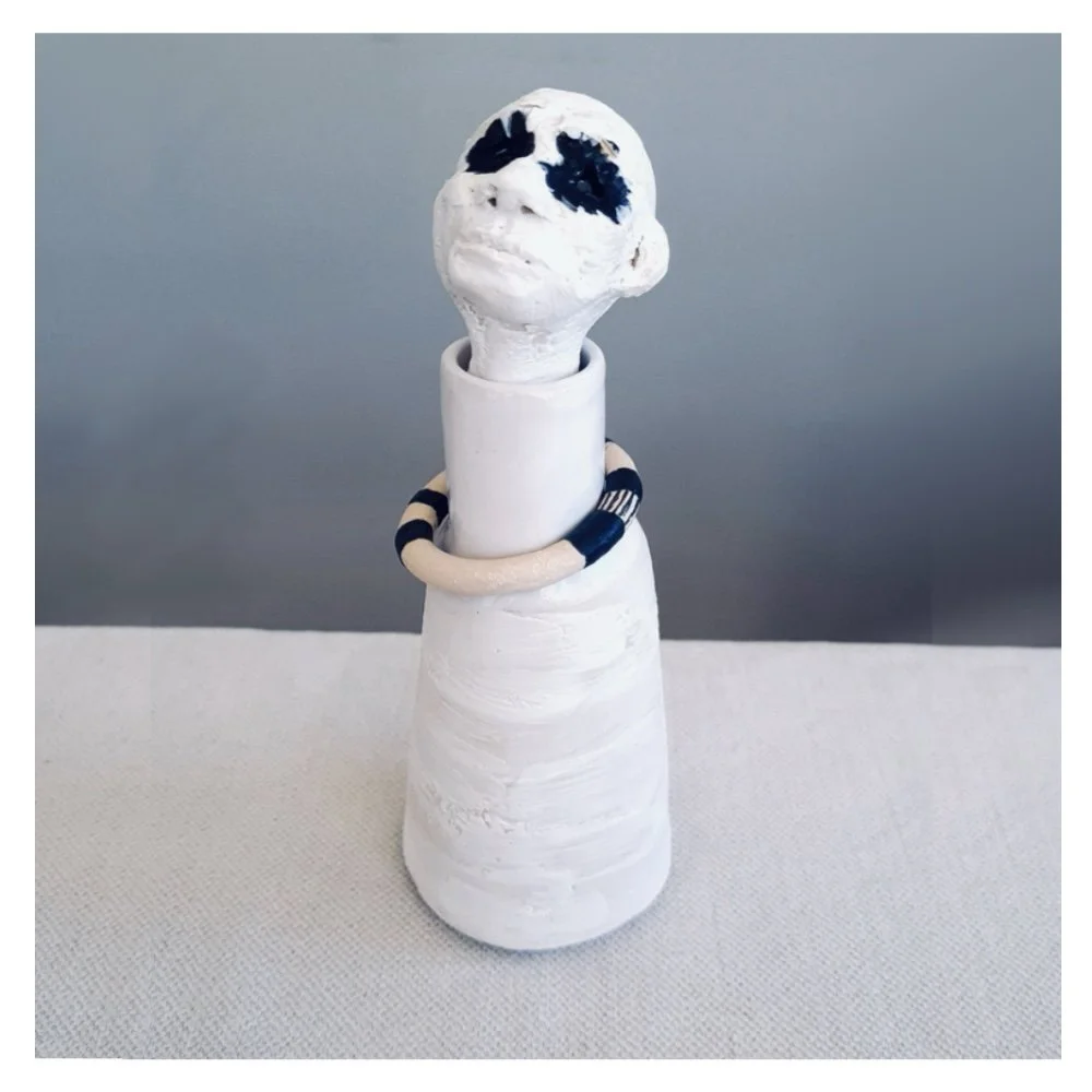 Figurative ceramic bottle in black and white
