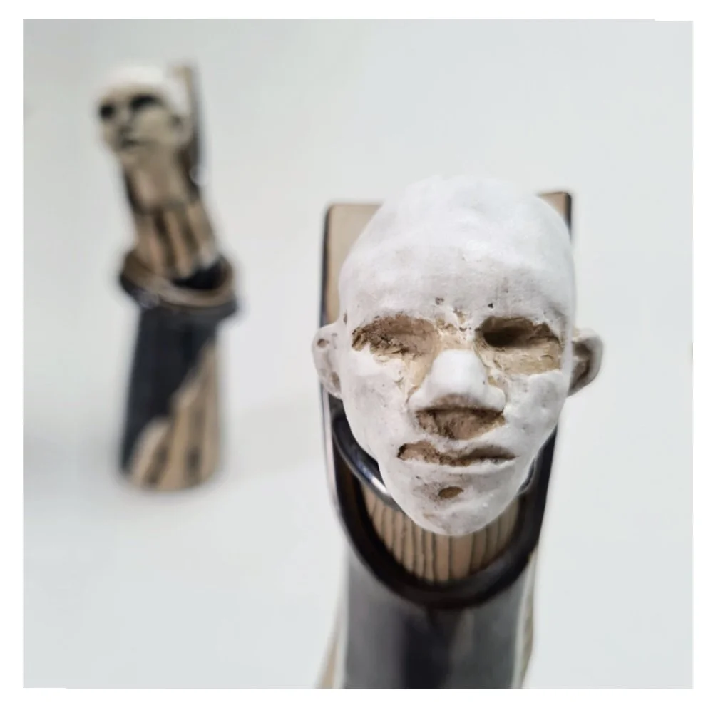 Vases with sculpted head stopper (close up)