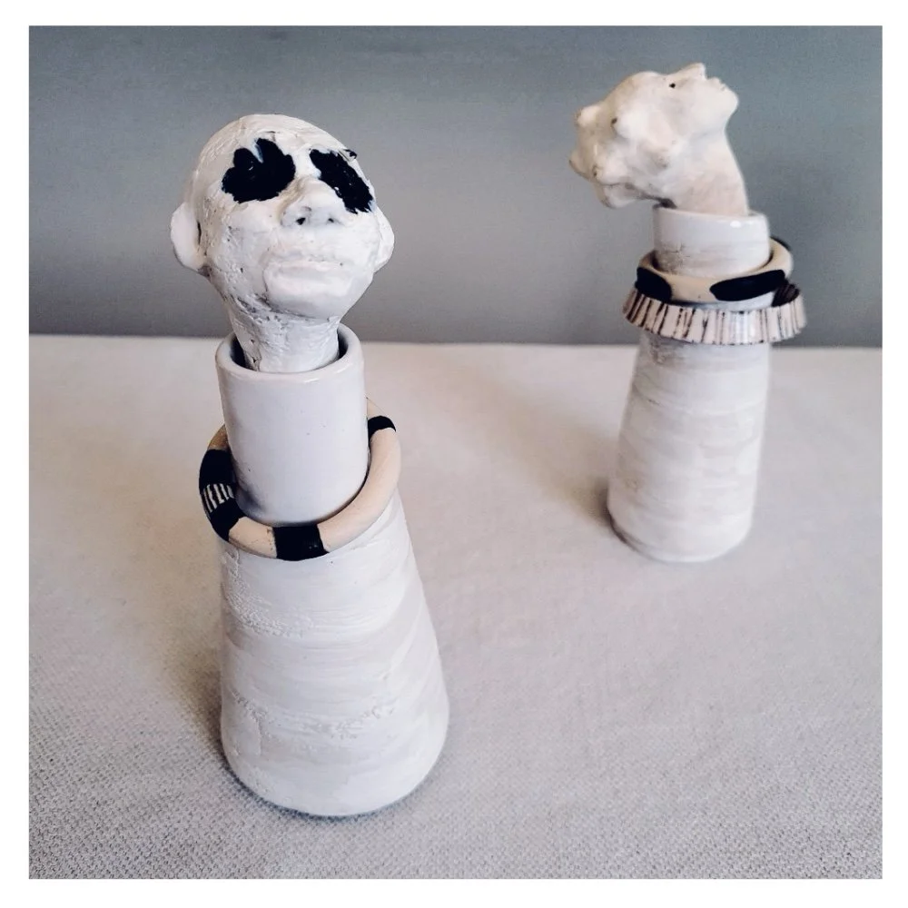 Figurative ceramic bottles in black and white