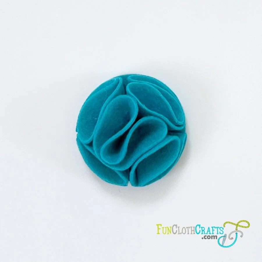 folded felt flower in blue