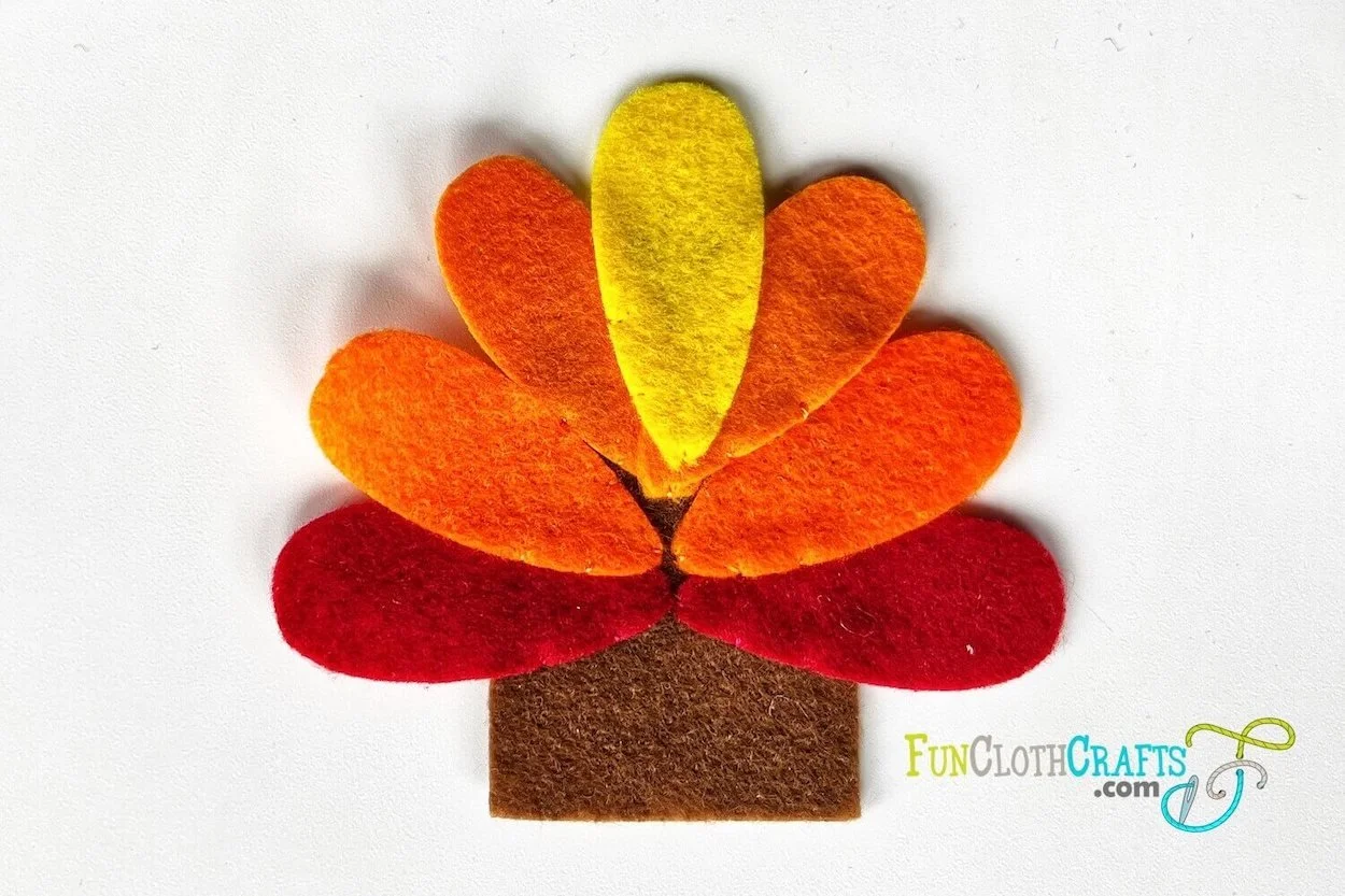 turkey finger puppet, sew feathers with whip stitch