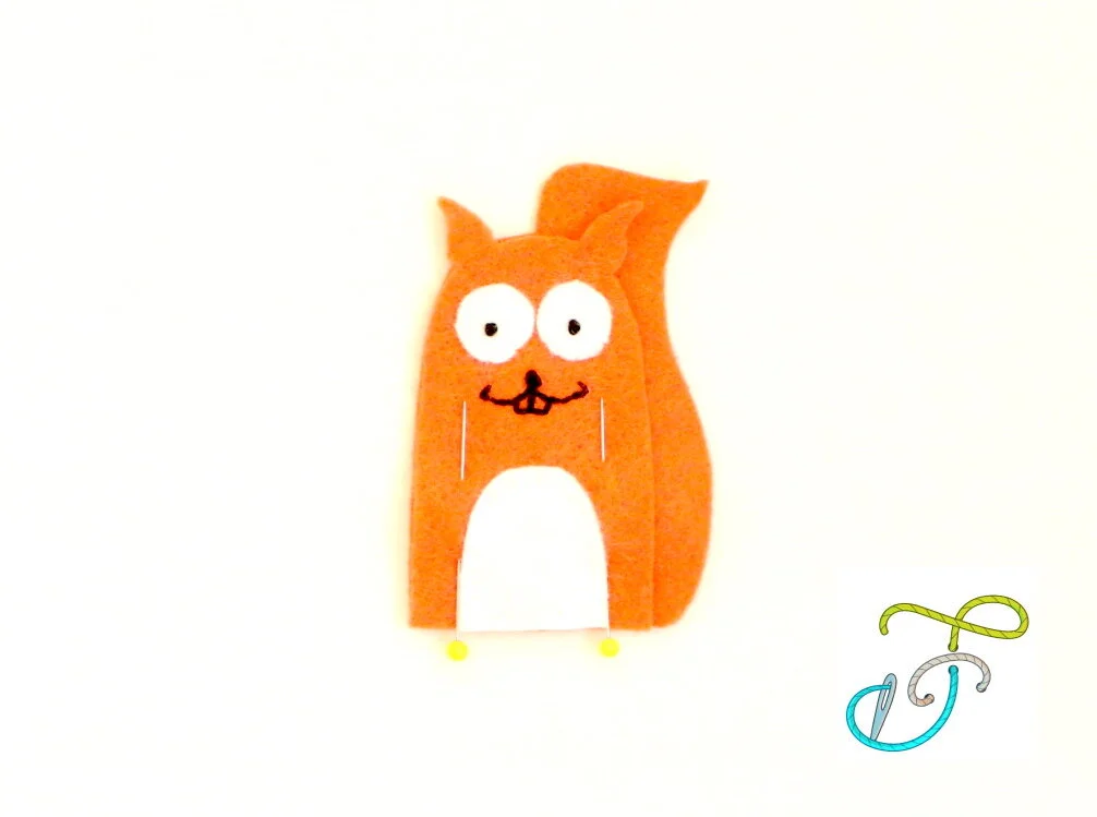Free pattern squirrel finger puppet body attached.jpg