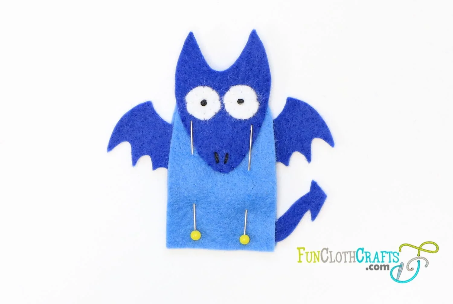 Pin dragon finger puppet’s front and back together