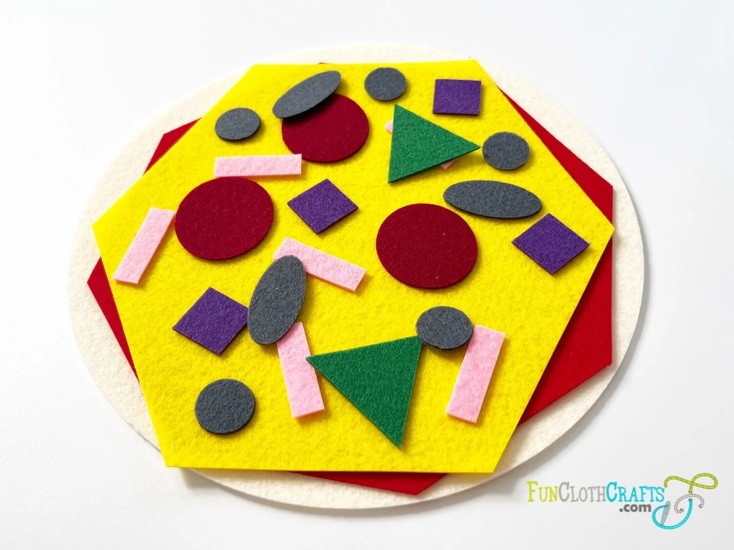 pizza felt shape activity - felt pizza with felt toppings  having different 2D shapes