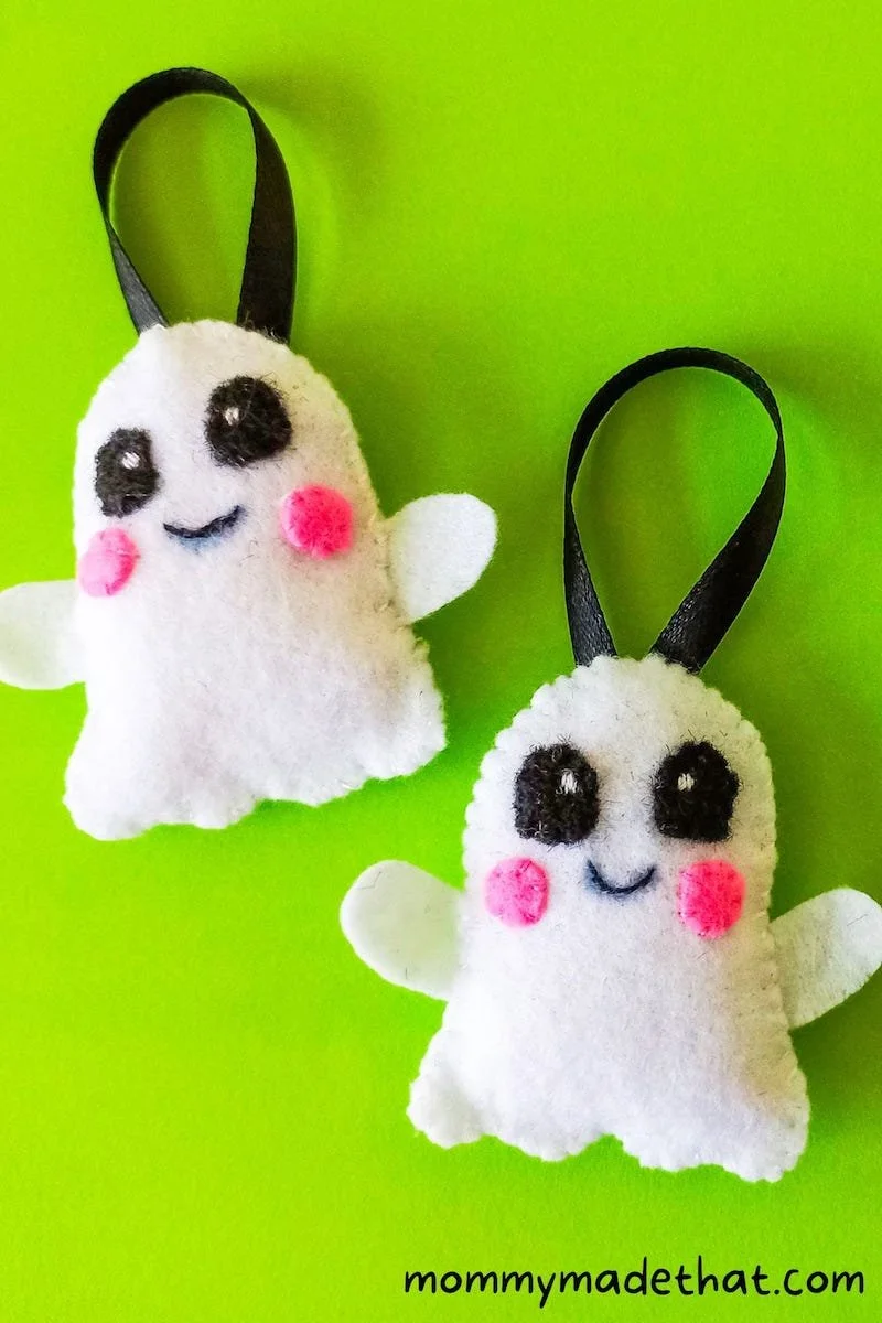 two smiley white felt ghost ornaments