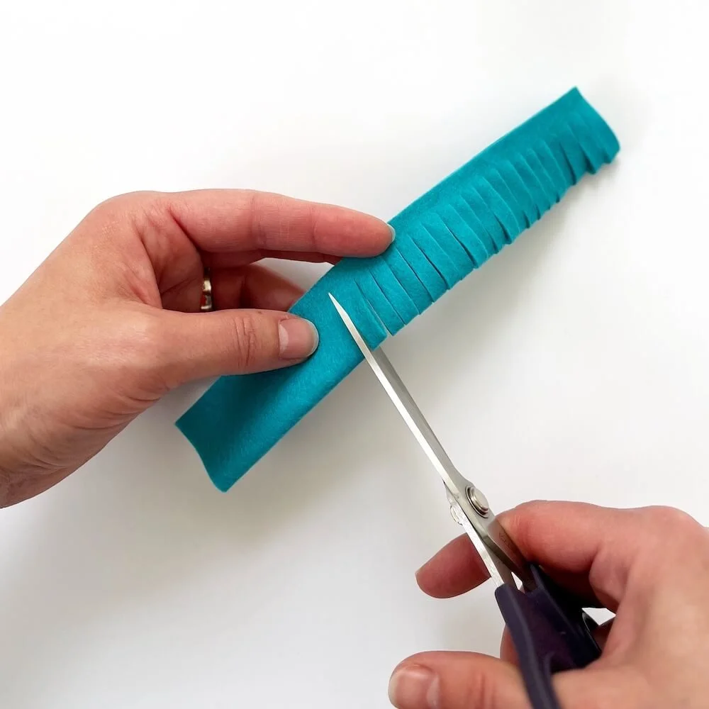 felt stripe cut into 3/4 to make rolled flower