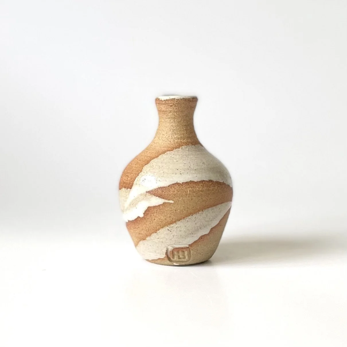Small stoneware bud vase glazed in white 1