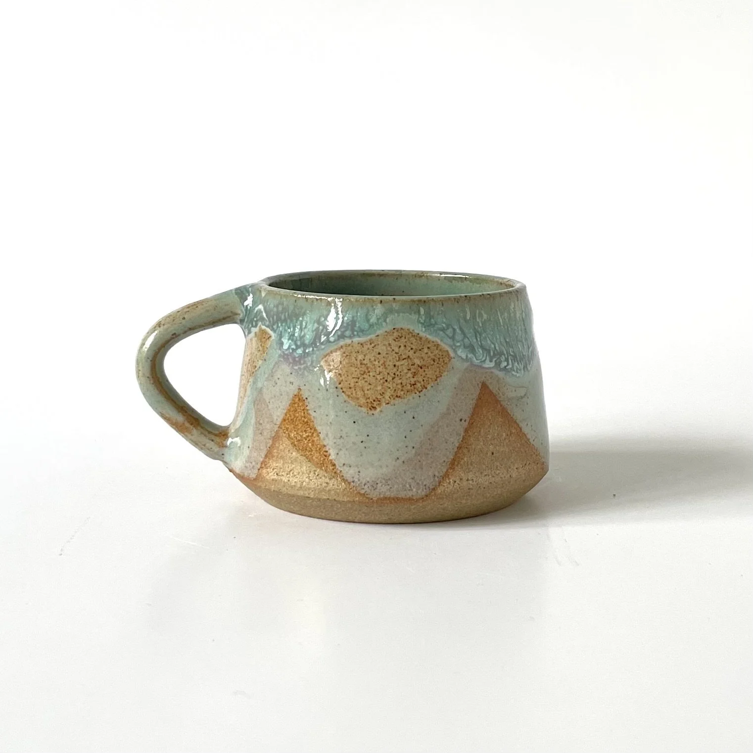 Small stoneware espresso cup in celadon and pink 2