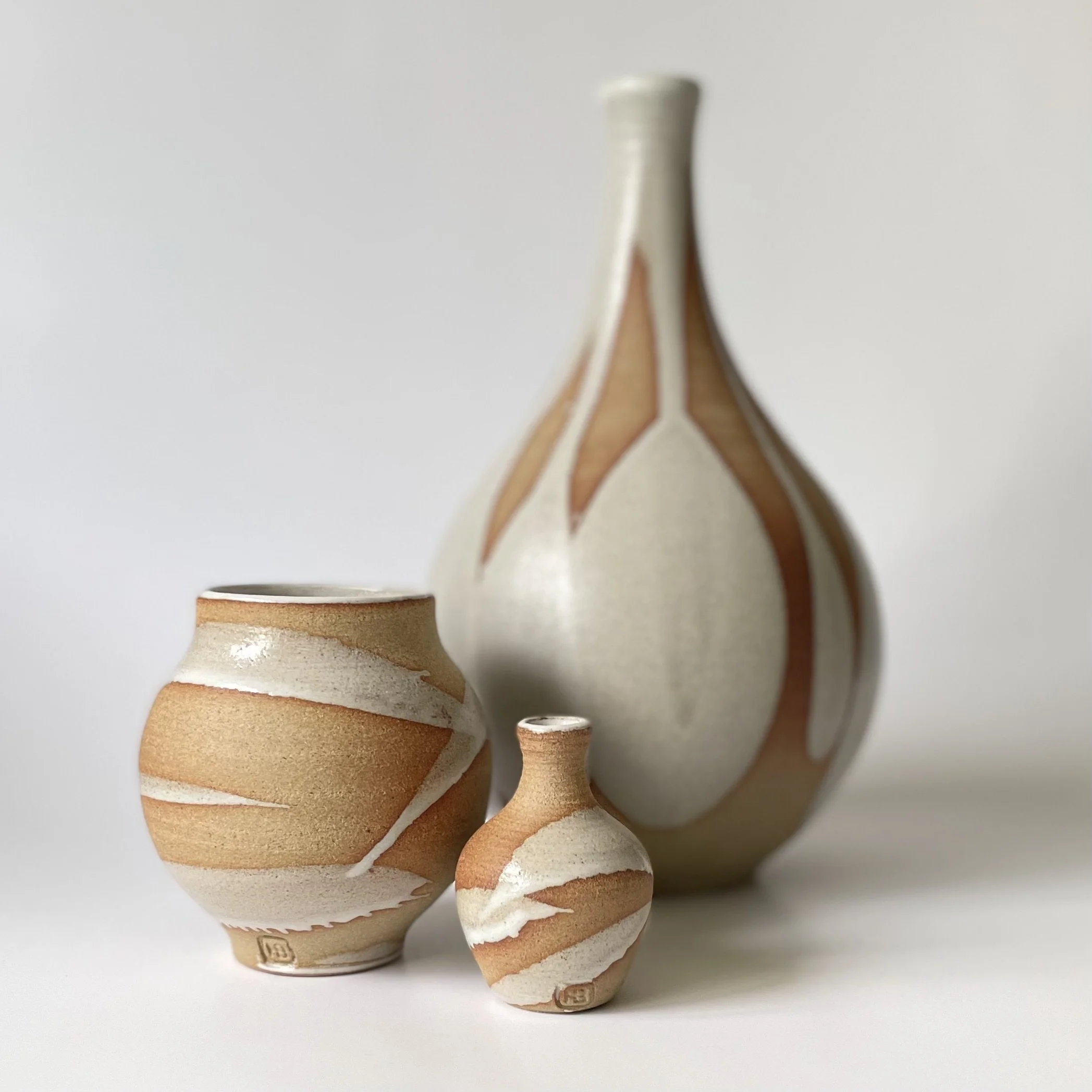Small stoneware bud vase glazed in white 4