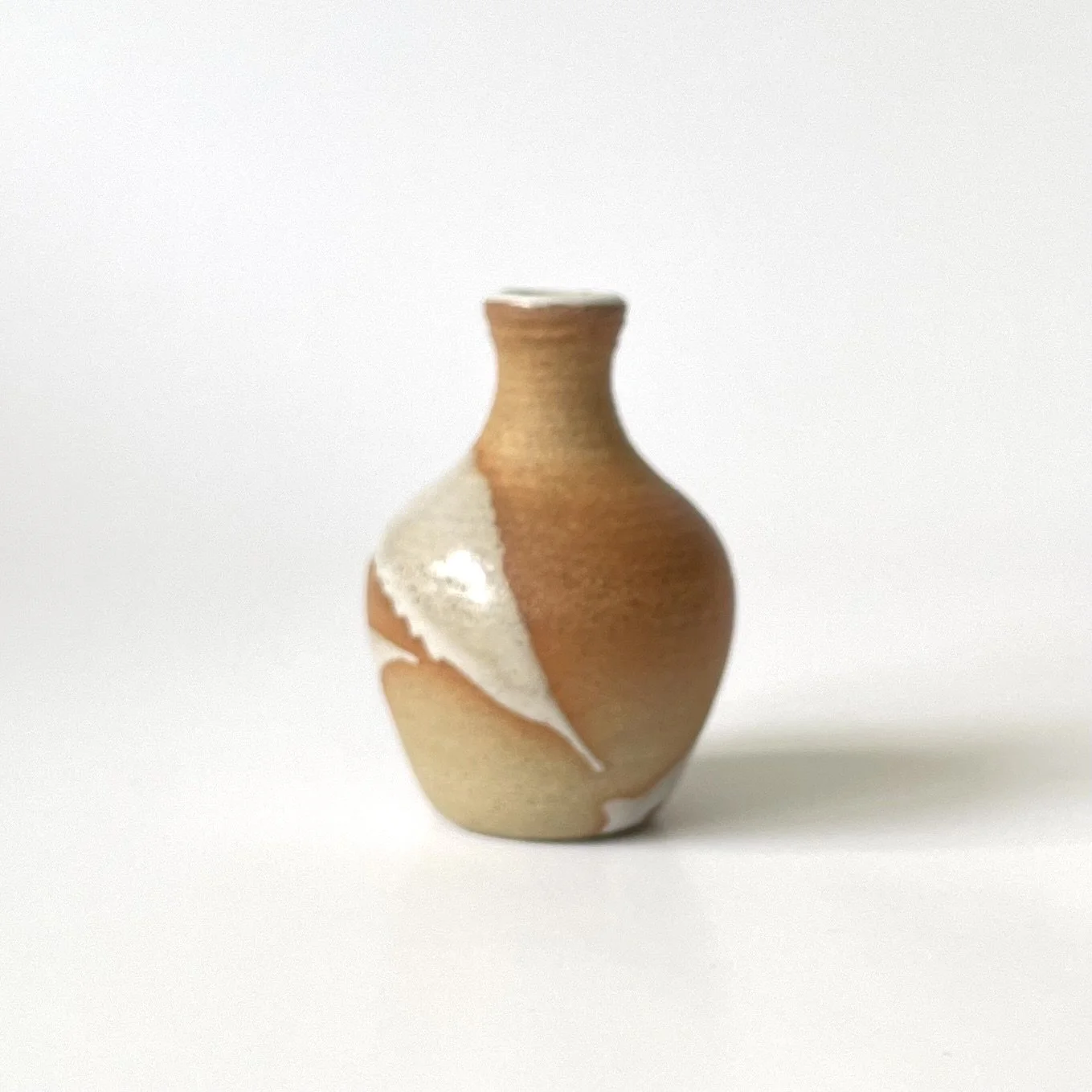 Small stoneware bud vase glazed in white 2