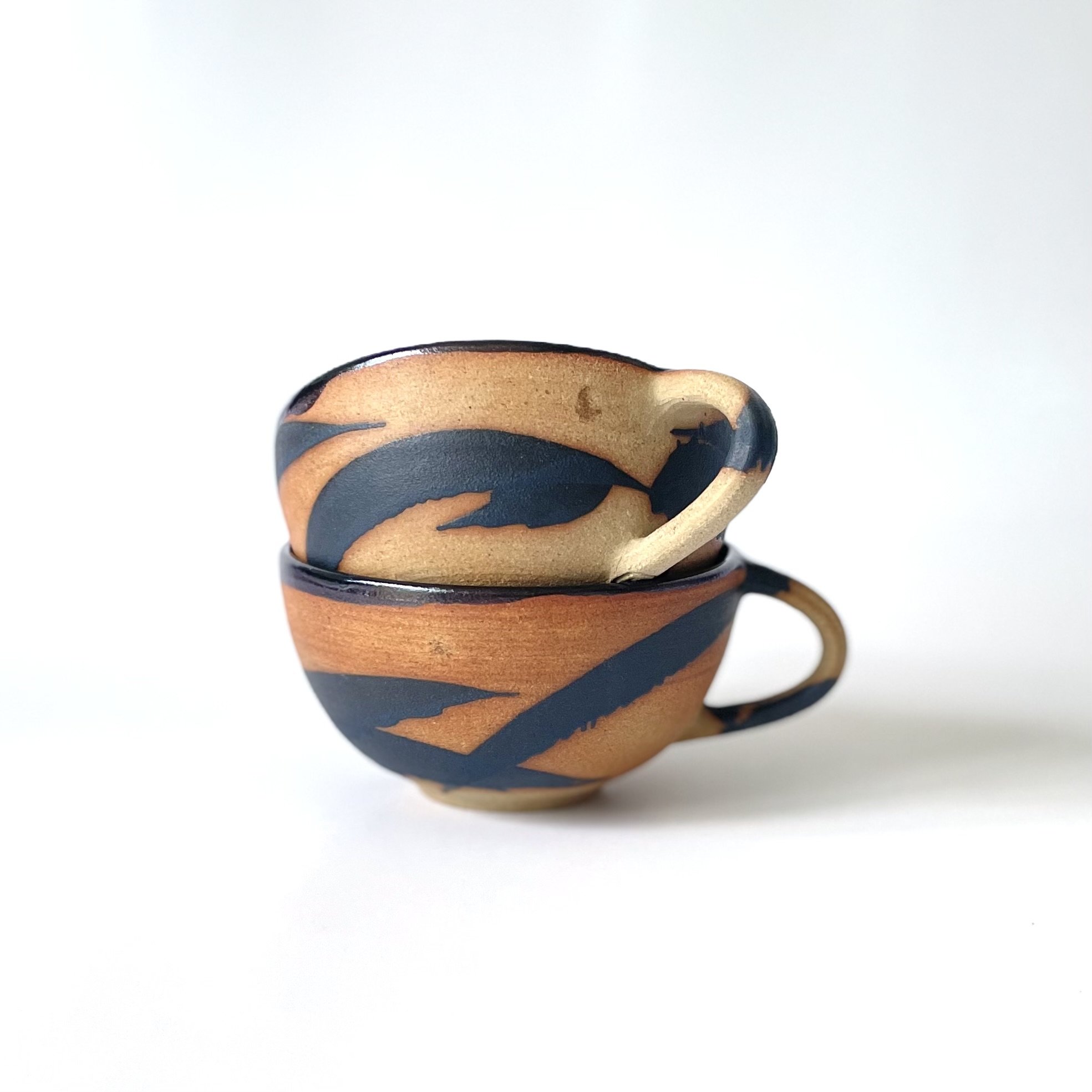 Hand thrown stoneware cups glazed in tenmoku and charcoal mark making 2