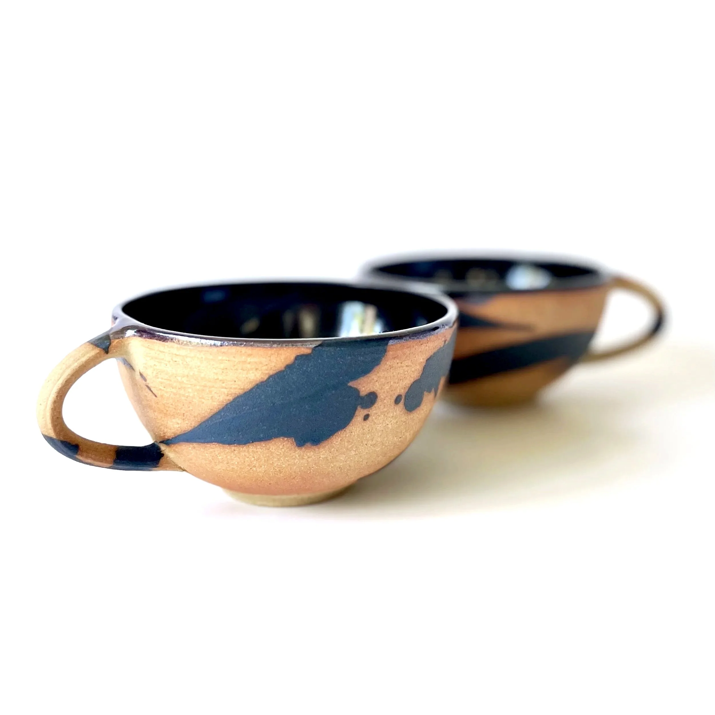 Hand thrown stoneware cups glazed in tenmoku and charcoal mark making 3