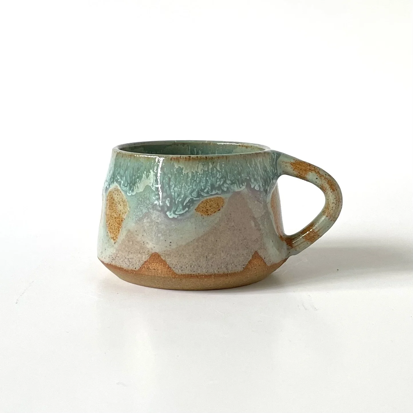 Small stoneware espresso cup in celadon and pink 1