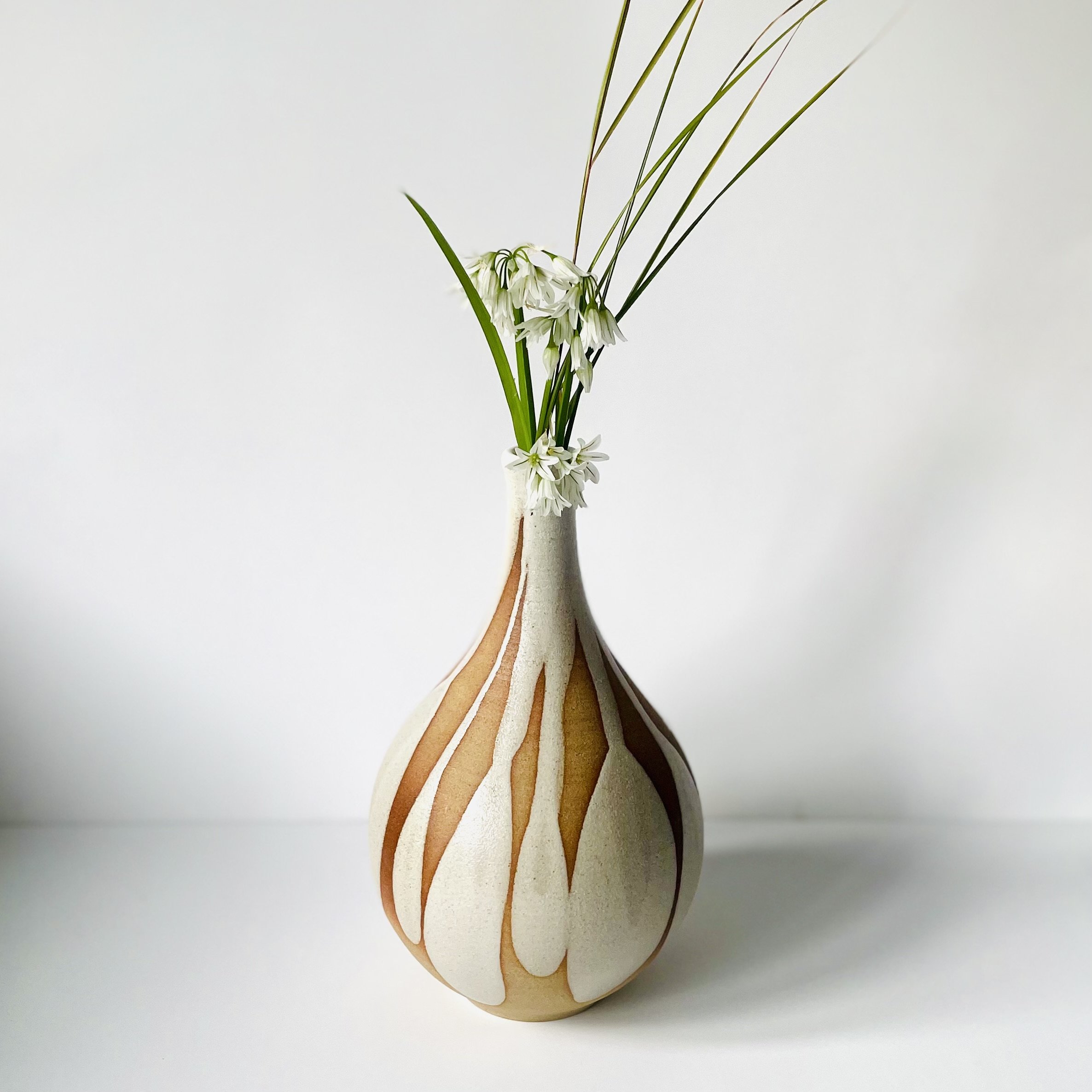 Narrow neck stoneware vase with white petal mark making 1