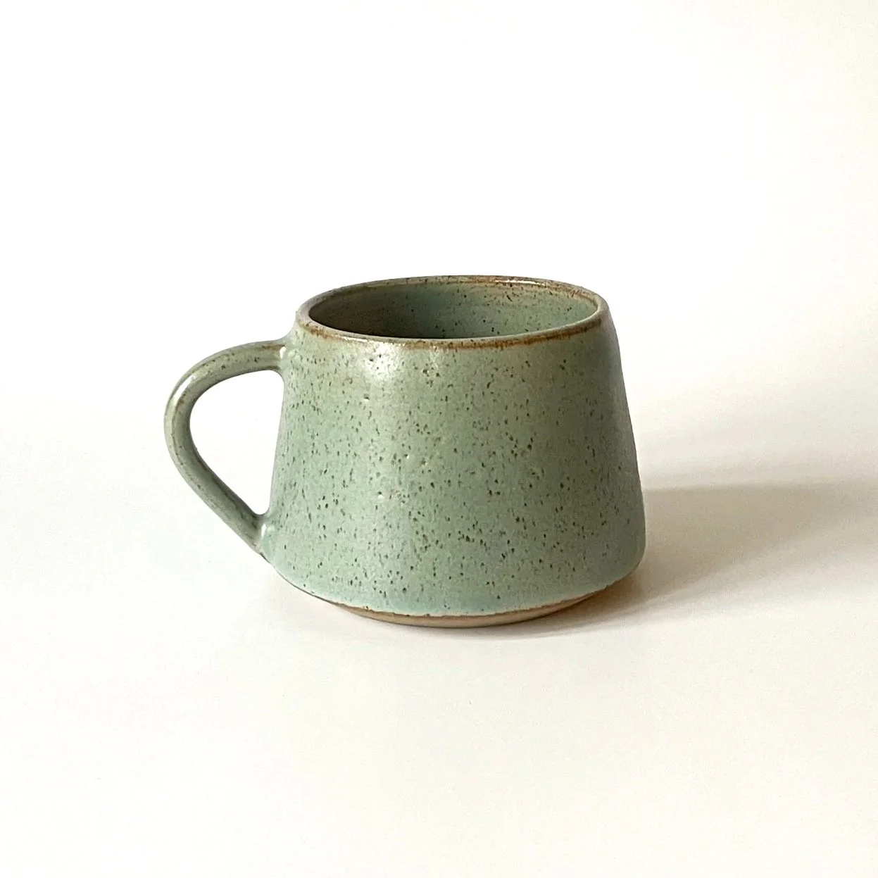 Hand thrown stoneware cup glazed in celadon 2
