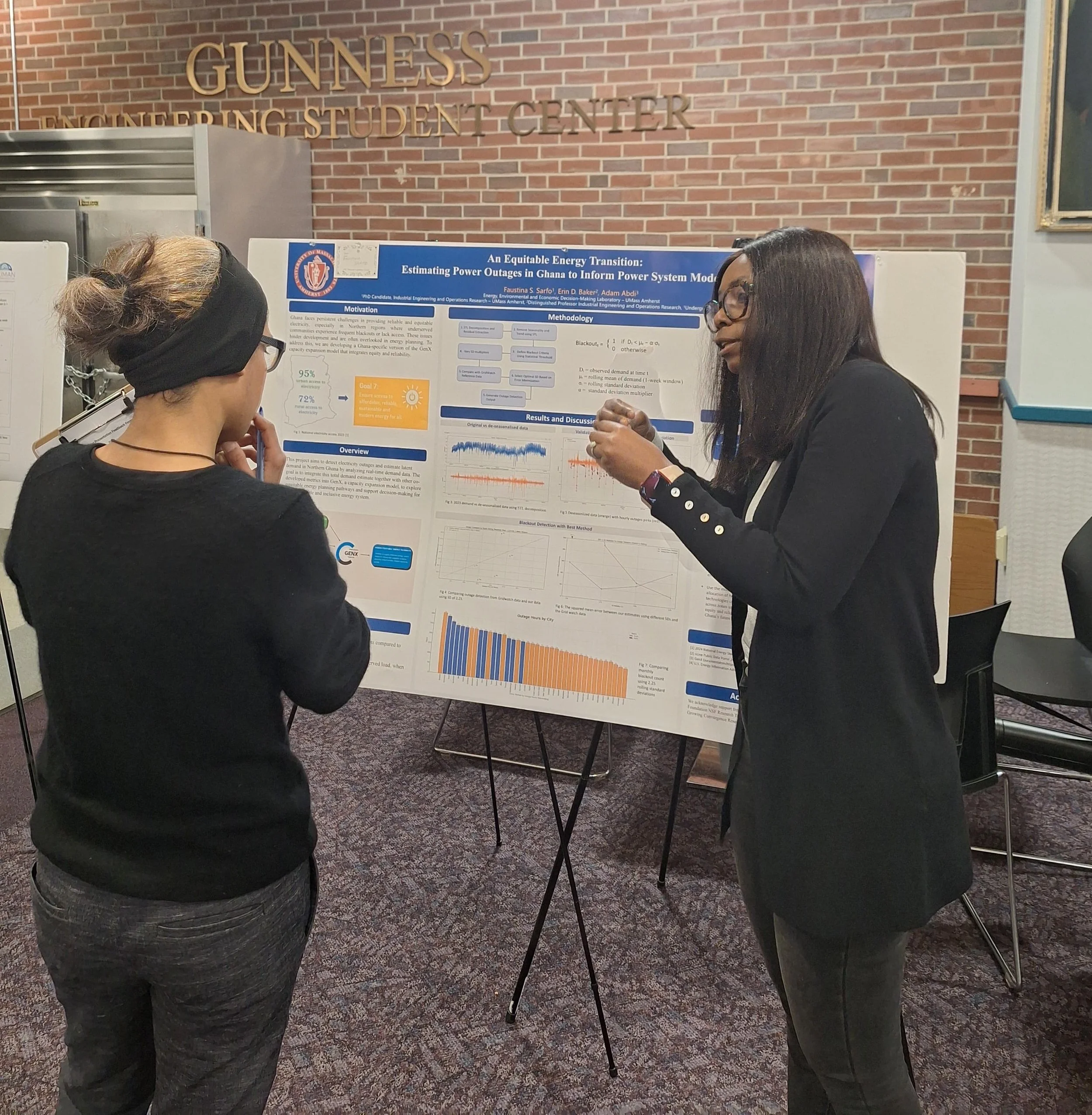 Faustina Sarfo presenting a poster at the MIE poster session