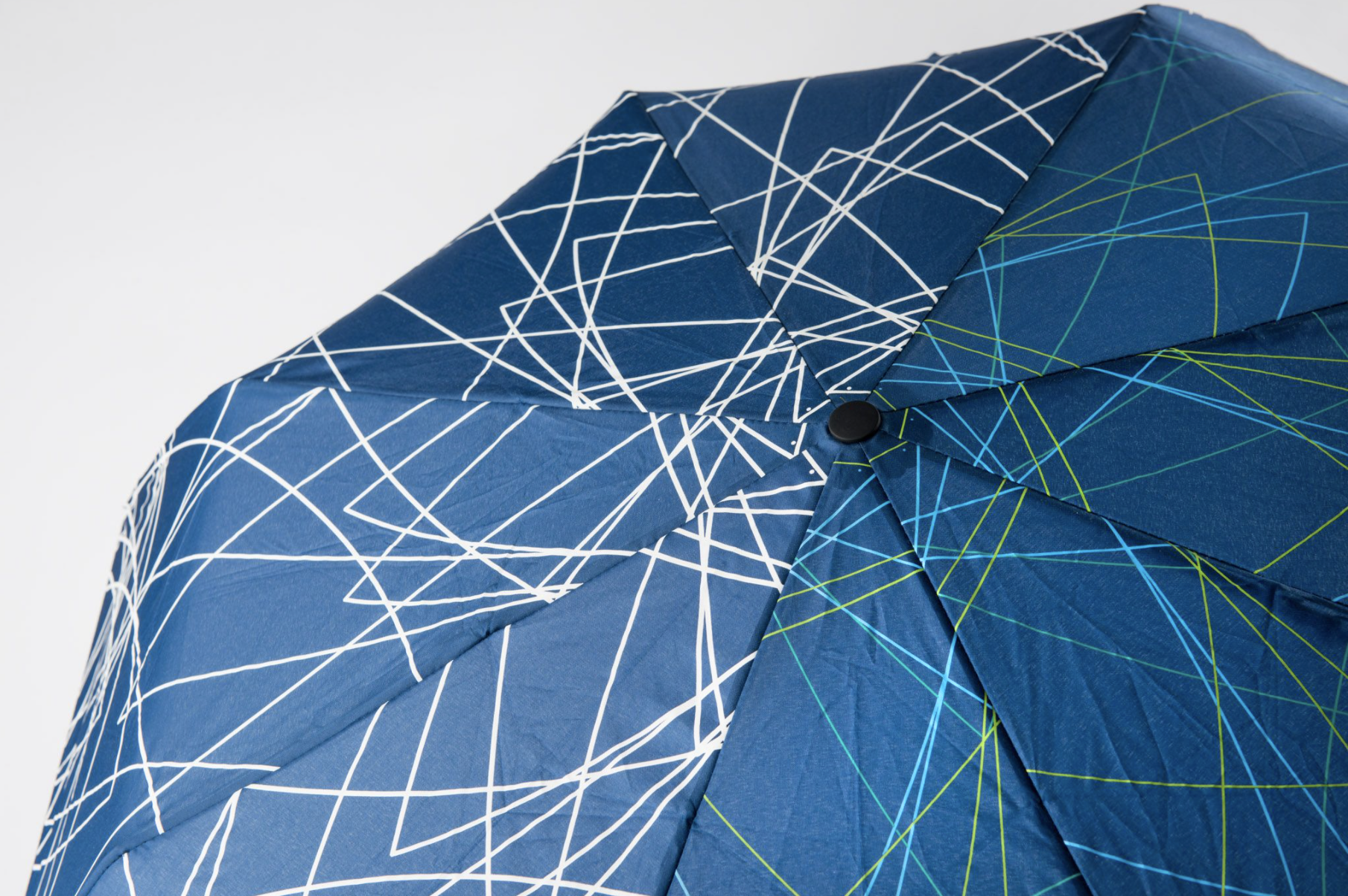 Product line for Crystal Bridges, with original branding. This umbrella changes color when it gets wet.
