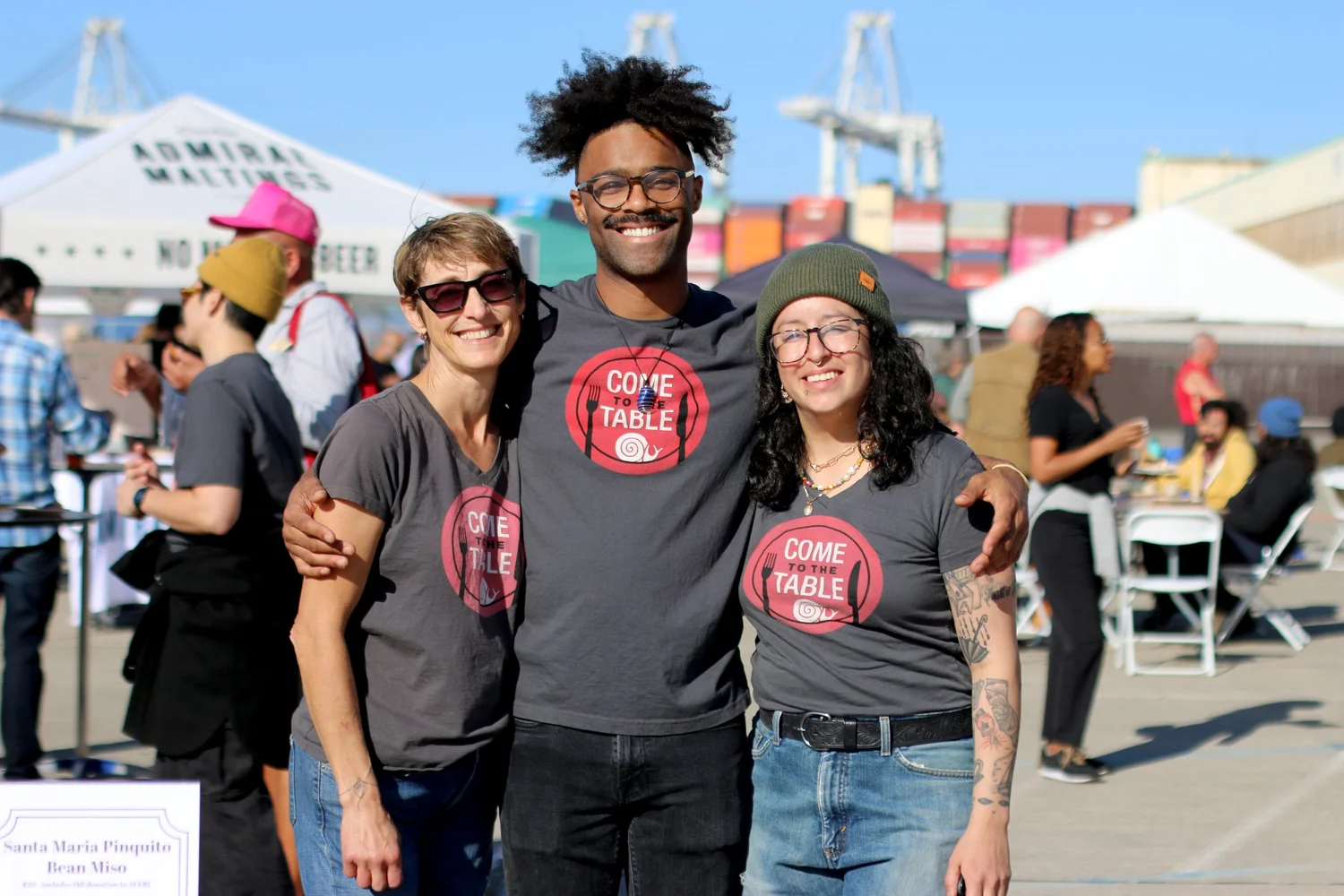 Slow Food East Bay volunteers in Come to the Table shirts at a community event