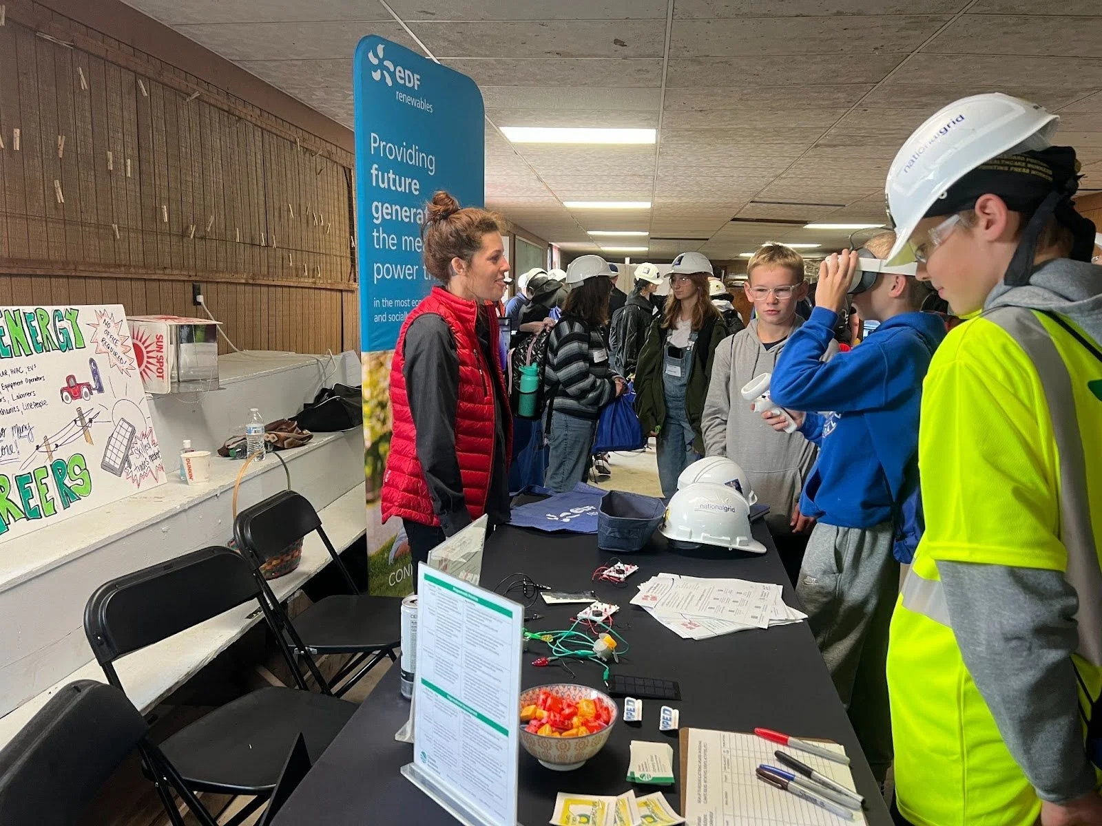 Haylee Ferrington of EDF Renewables and Renewable Energy Working Group, tabling at GLOW With Your Hands in September 2024.