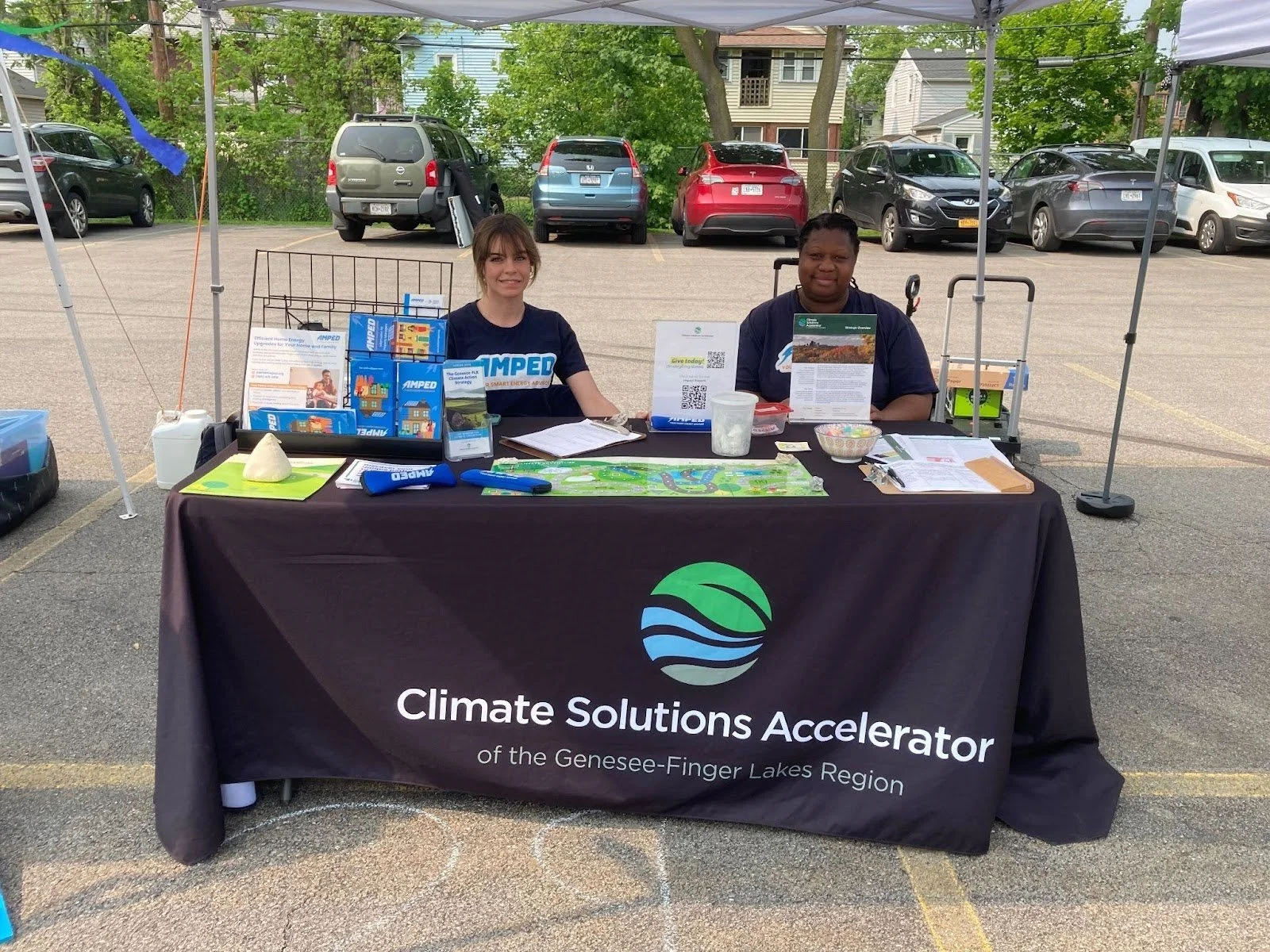 Hannah DeRomanis, Intern and Andrea McLean, Public Engagement Coordinator, tabling at the Rochester Eco Fair, June 2025.
