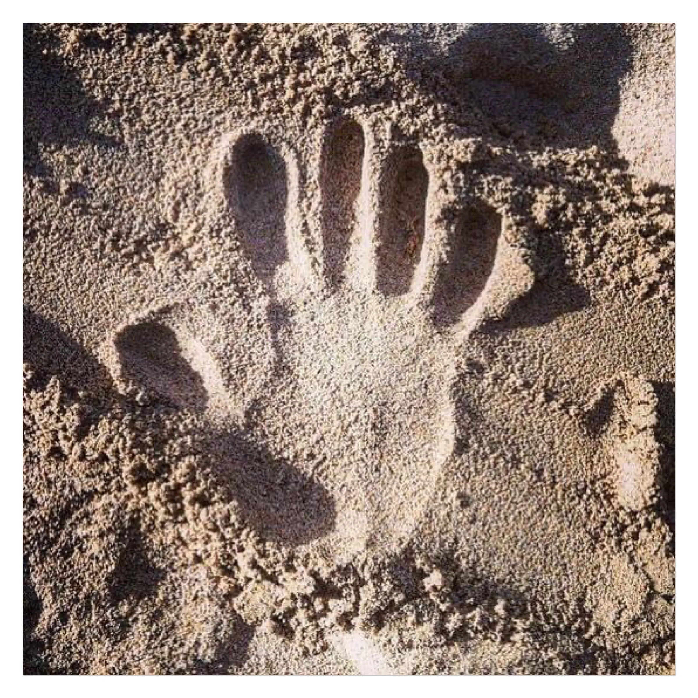 hand print in the sand