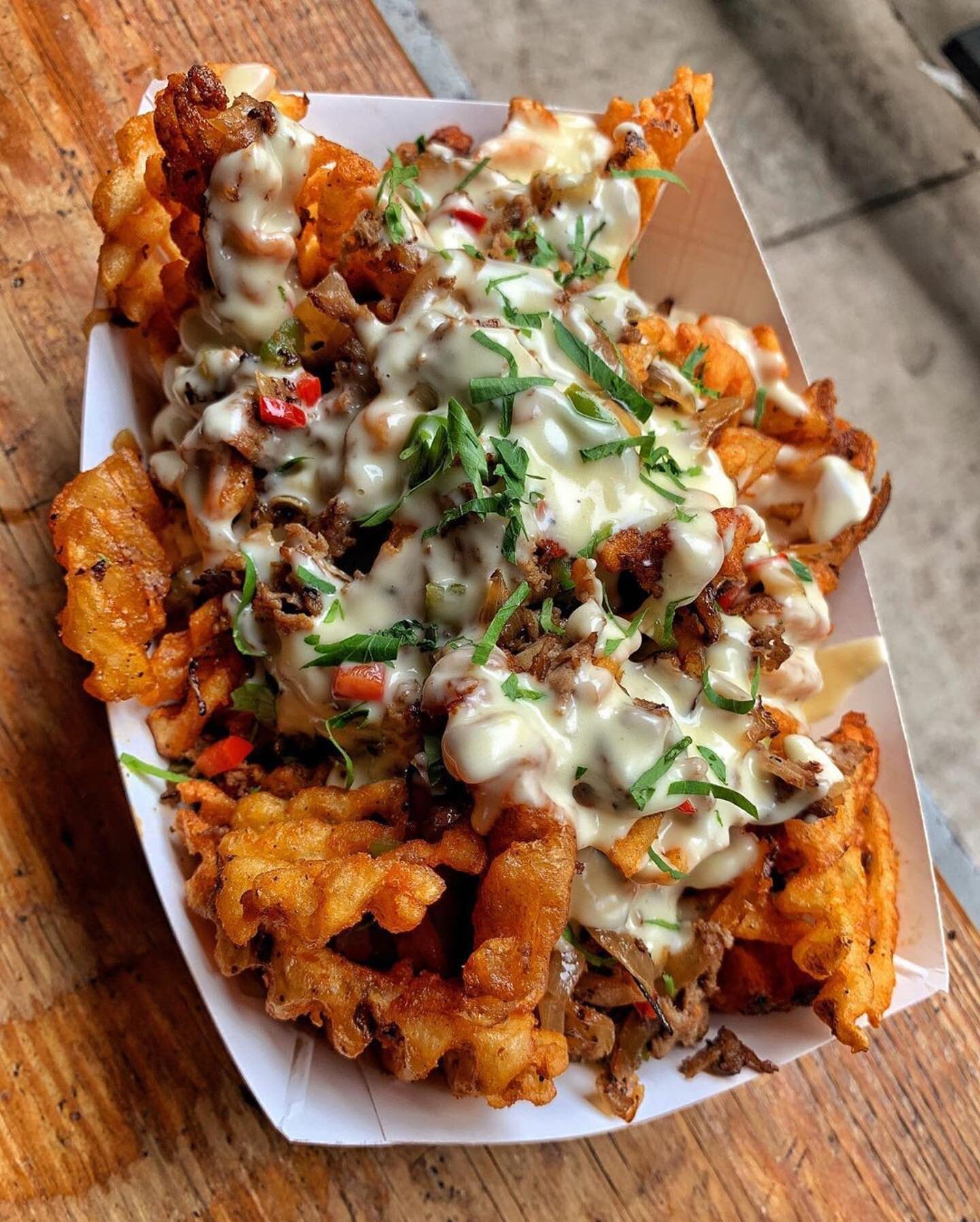 STEAK-UMM FRIES for #FryDay! 🍟💥 Seasoned waffle fries topped with chopped steak, STEEZ sauce, peppers &amp; onions. Let the weekend begin. #ATTHEWALLACE