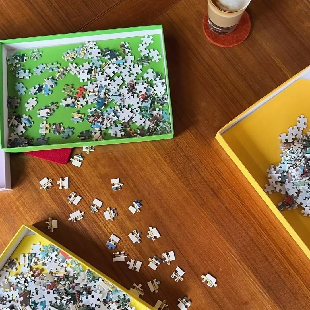 Amidst the pitter-patter of raindrops, we witness a remarkable spectacle: armed only with cappuccinos, these Cavallini employees tackle the Japanese Woodblocks 1,000 piece puzzle, a calming respite from the doom and gloom of a stormy Saturday&nbsp;🌧