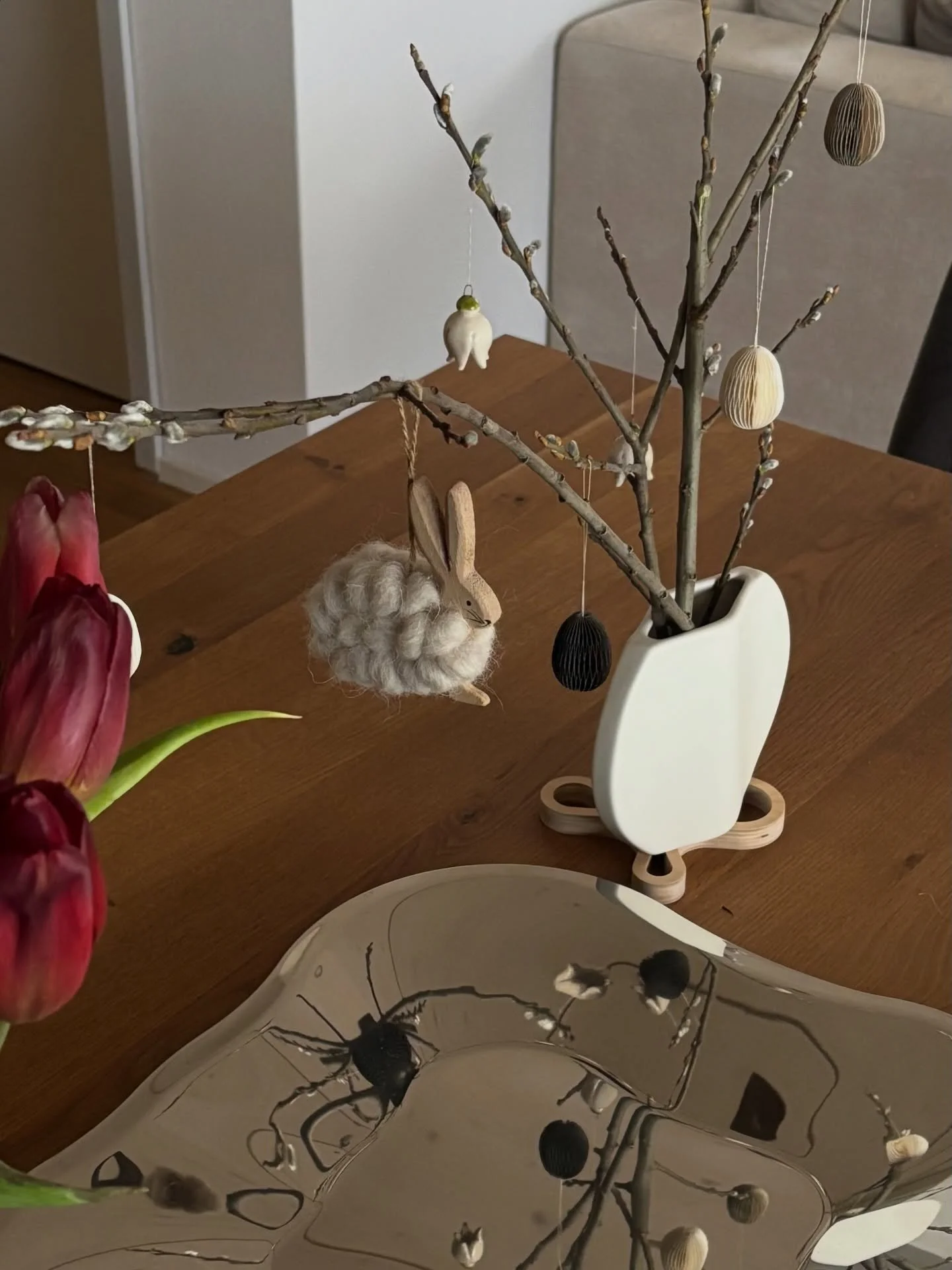 simple little spring decoration ☀️

got the oval white vase a few years back secondhand max 2.-, little secondhand bunny for 1.-, little ceramic pendants from a market in Vienna, paper eggs from a store clearance 1&euro;, small wavy vase was a gift a
