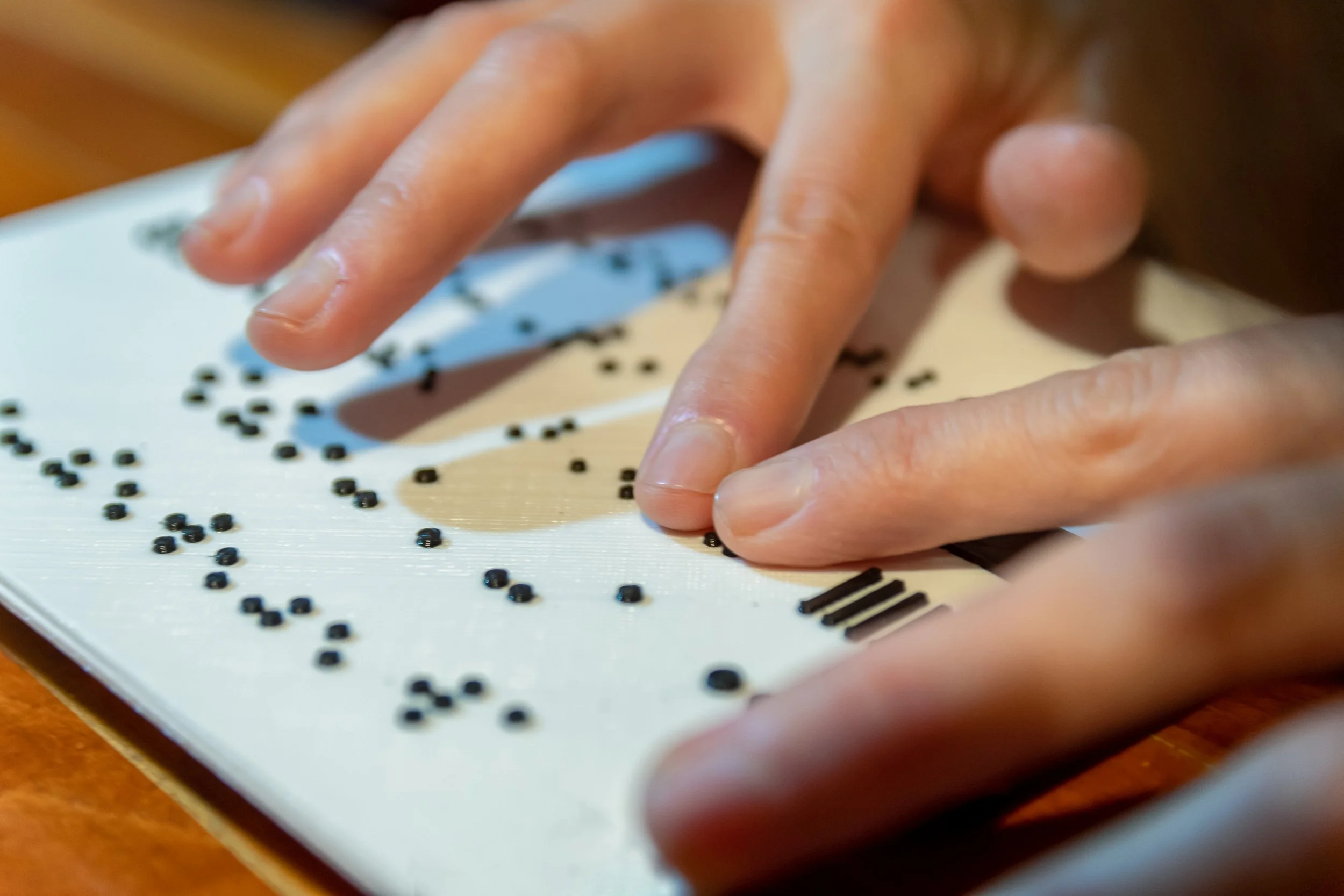 woman-hands-reading-braille-text.jpg