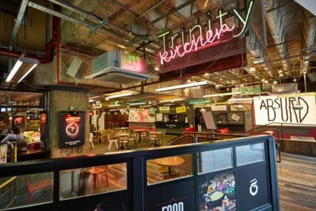 Trinity Kitchen in Leeds, UK, is one of the oldest examples of local offers being successfully combined with international offers within a shopping center.
