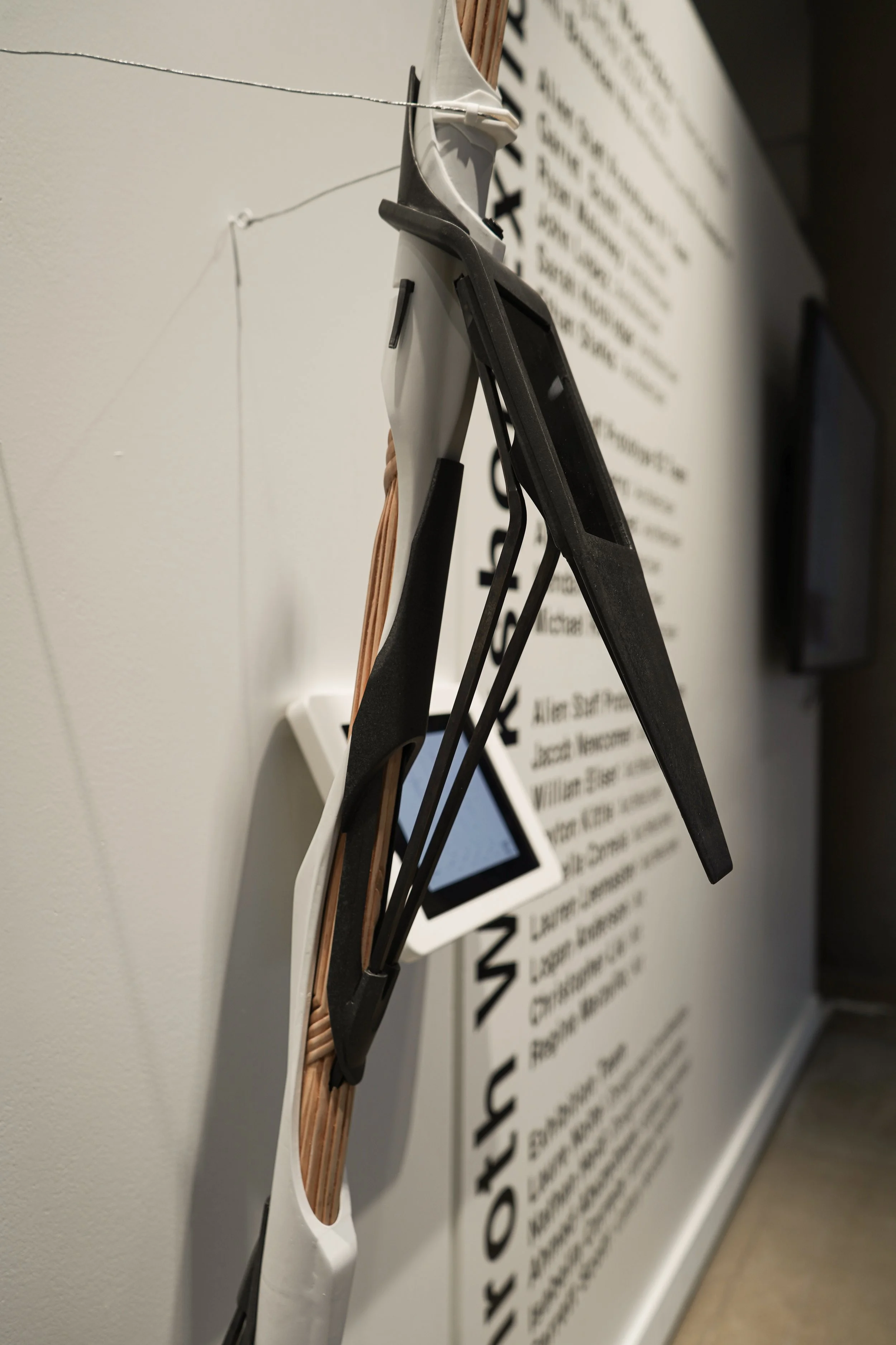 Close up shot, showing the left side of a student dark gray and white walking stick from Wodiczko's workshop