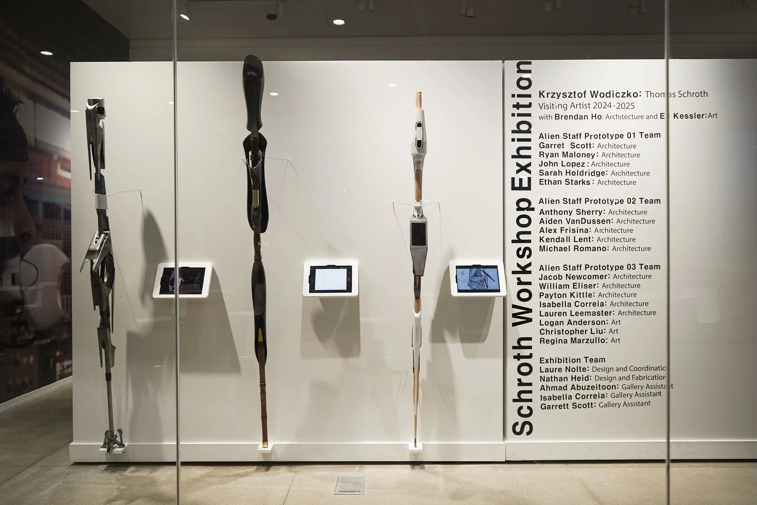 Close up of student instruments created with Krzysztof with ipad playing videos. Wall shows Schroth Workshop Exhibition text and student names in the workshop