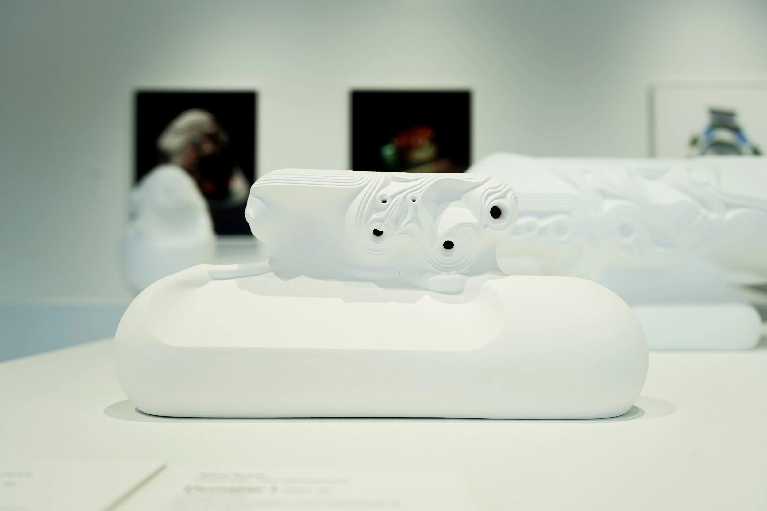 Ceramicology exhibit showing white sculpture on table