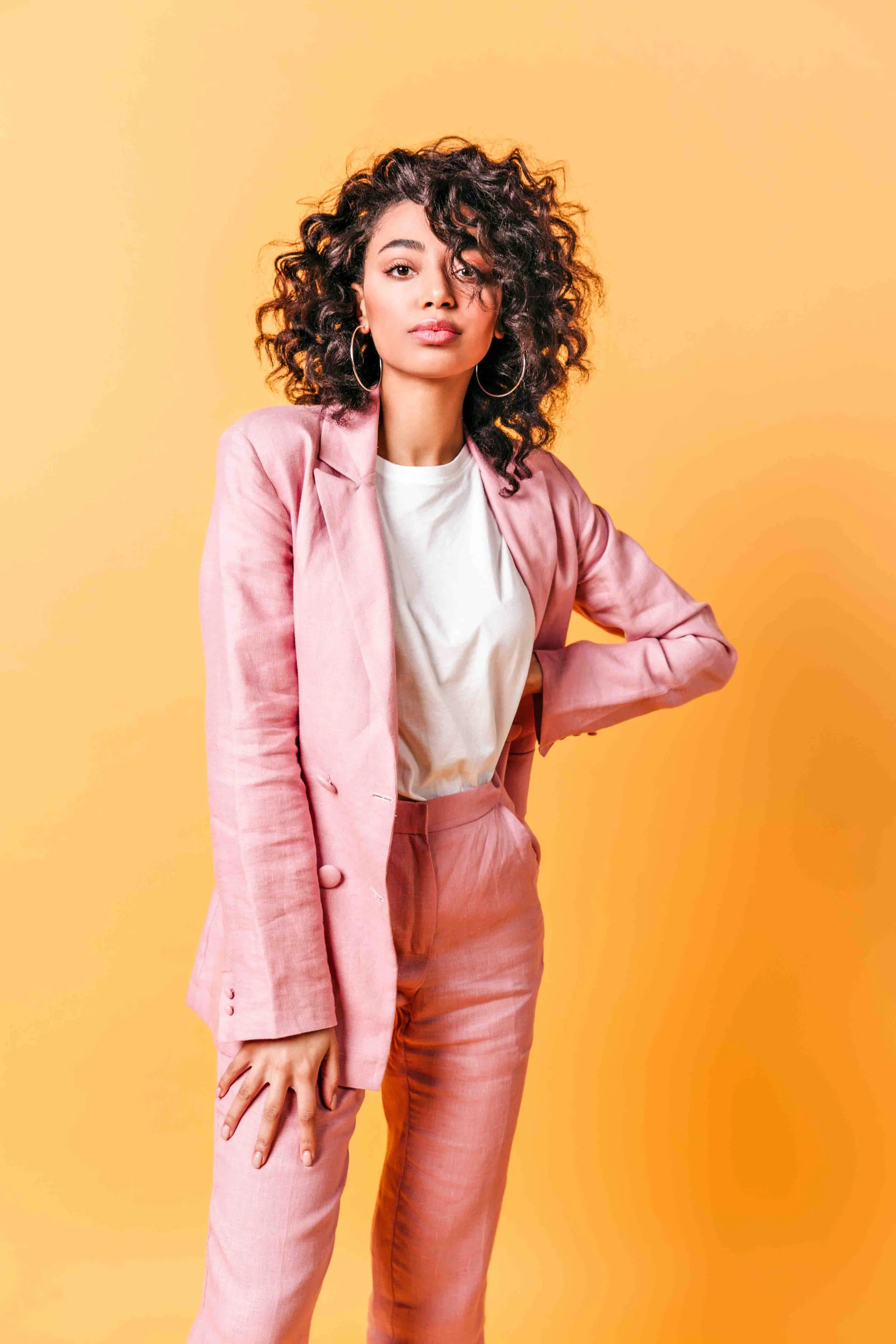 front-view-of-beautiful-girl-in-pink-suit-curly-m-2022-02-08-06-03-52-utc.jpg